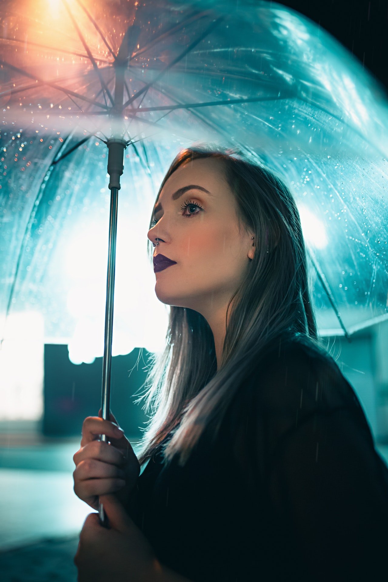 Alice went out with an umbrella to check things out. | Source: Pexels