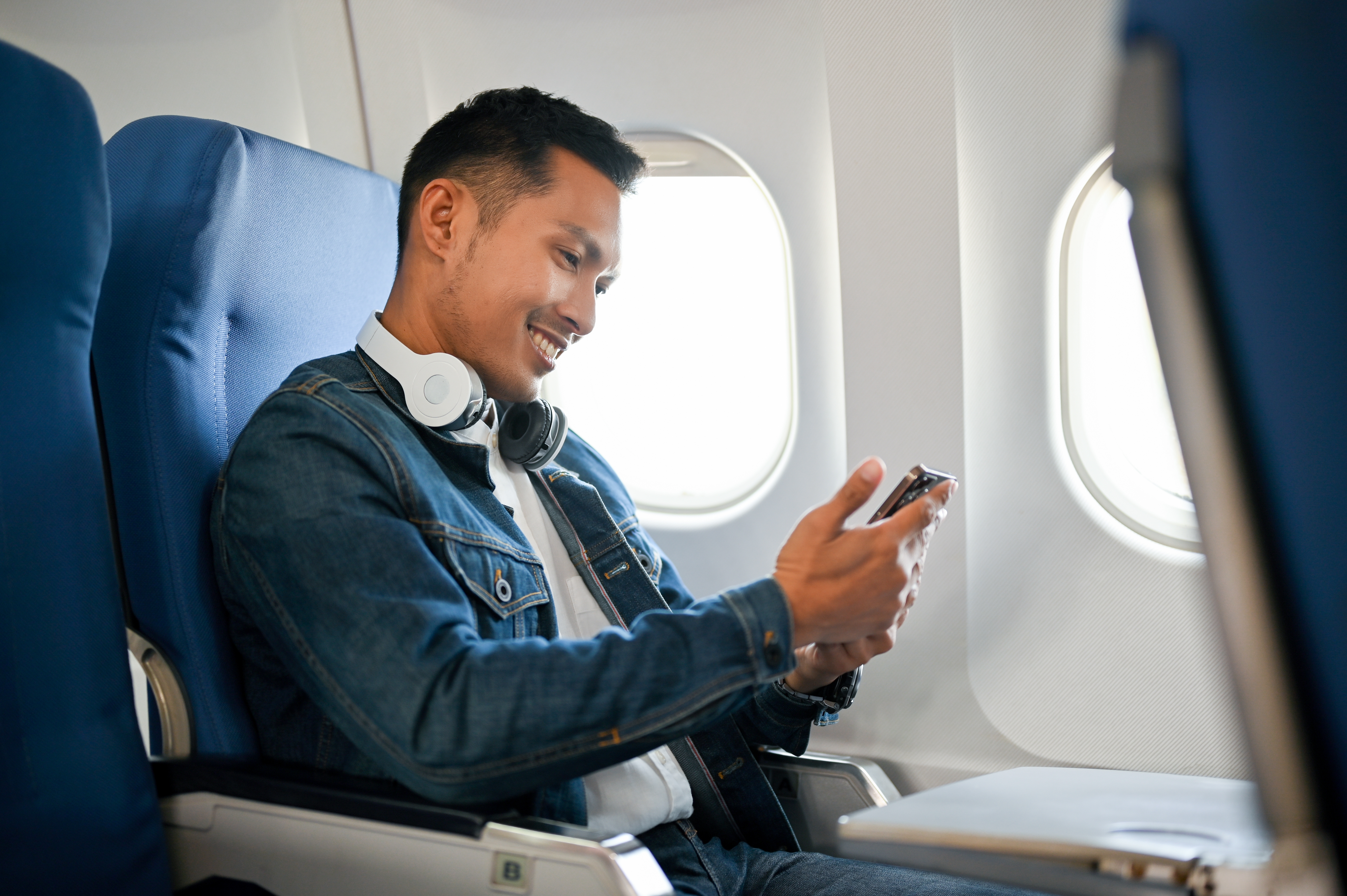 Young man on a plane | Source: Shutterstock