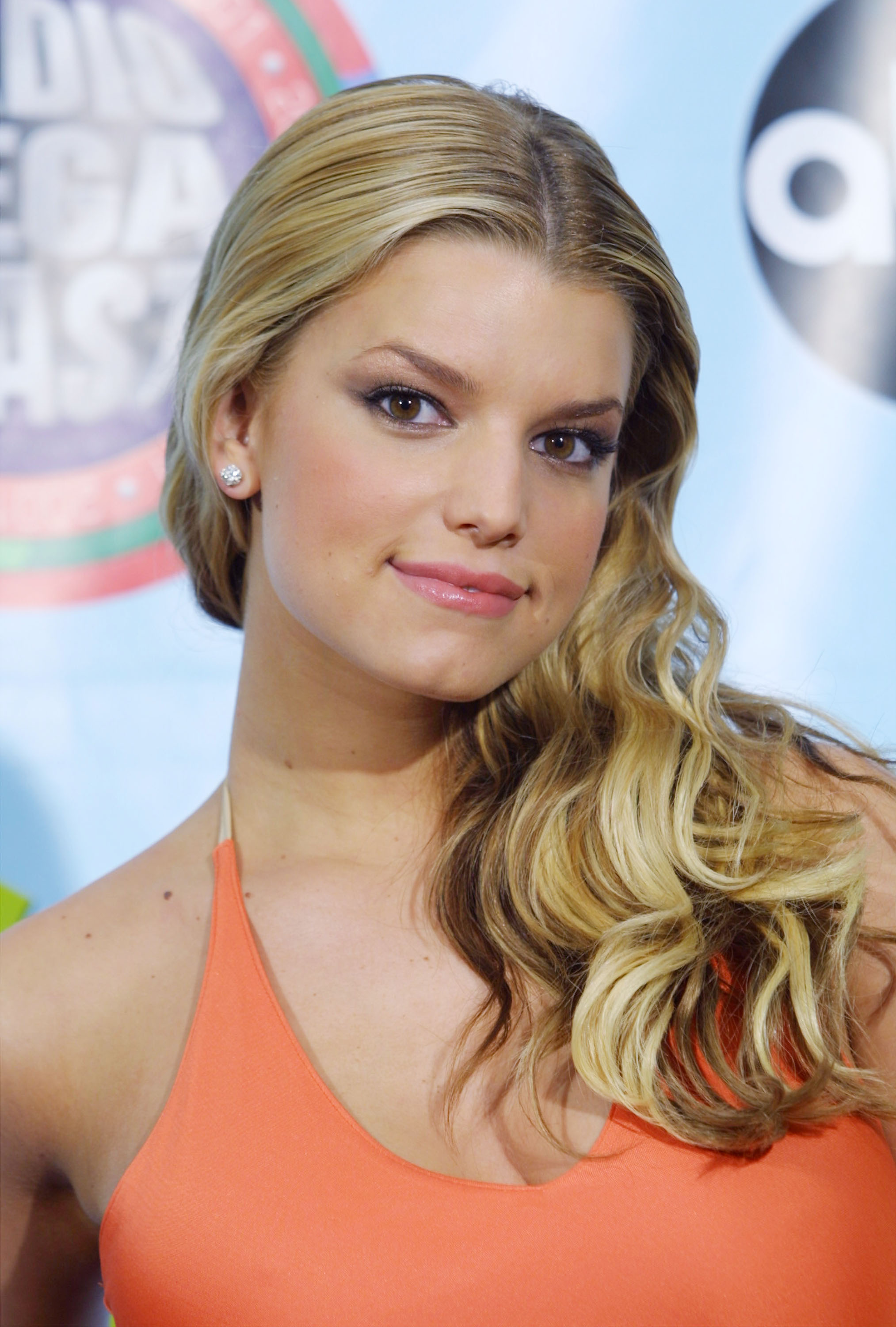 Jessica Simpson posed backstage at the 2001 Radio Music Awards in Las Vegas. With soft curls, a peach halter top, and fresh-faced makeup, she radiated youthful charm at the height of her pop breakthrough.