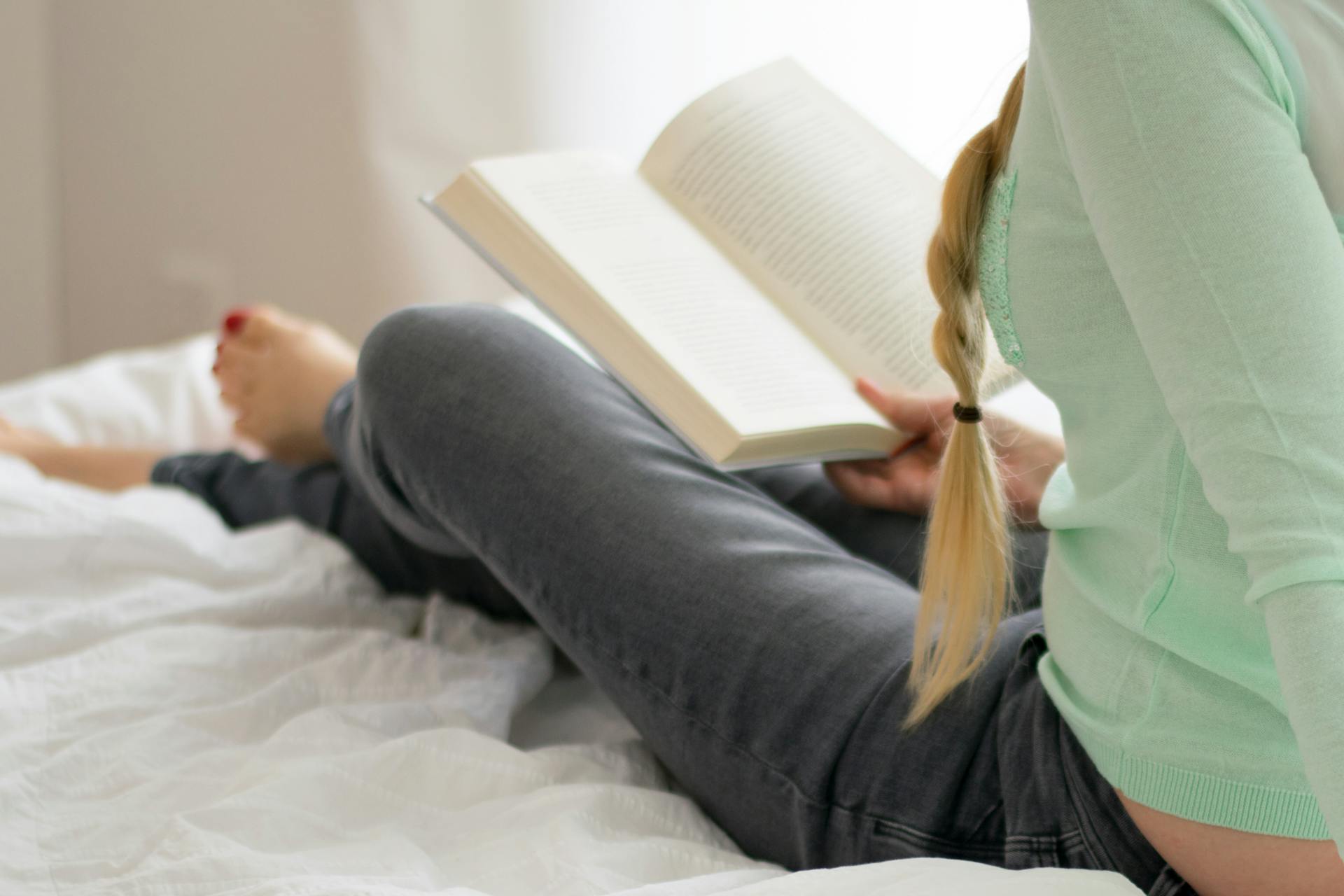 A woman reading a book | Source:  Pexels