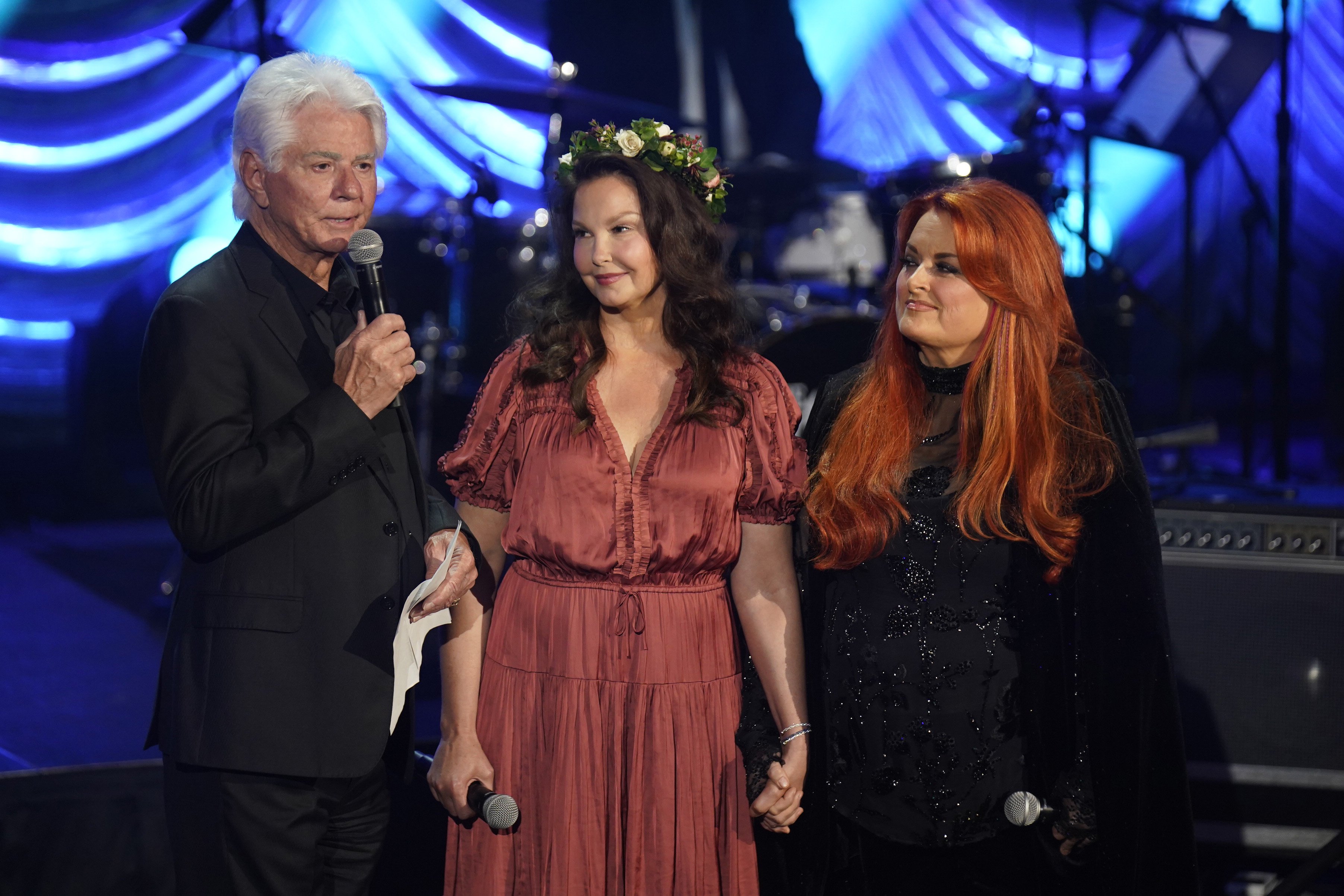 Larry Strickland, Ashley and Wynonna Judd onstage at the "Naomi Judd: A River Of Time" Celebration on May 15, 2022, in Nashville, Tennessee. | Source: Mickey Bernal/Getty Images