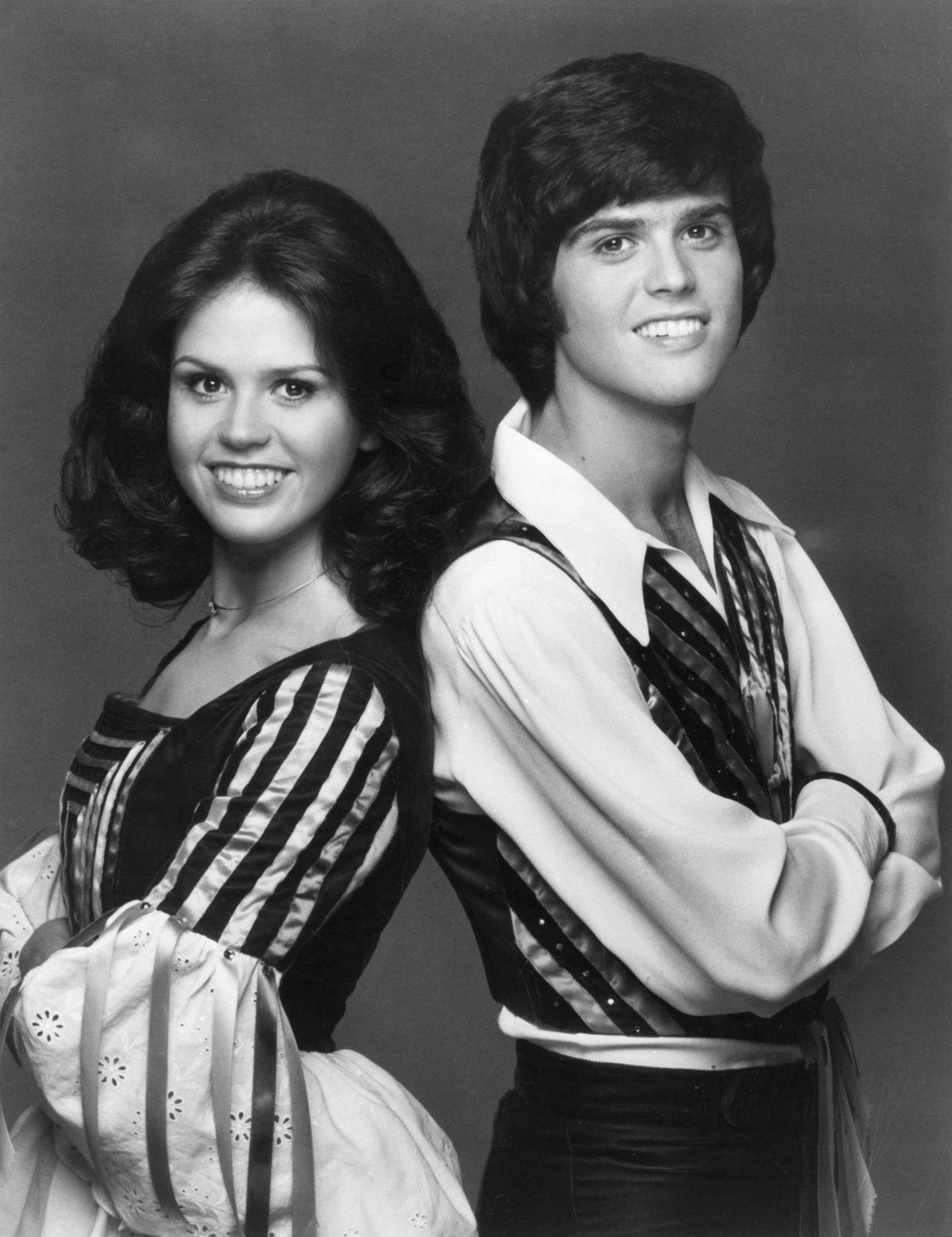 Marie and Donny Osmond posing in a black and white photograph in 1975. | Source: Getty Images