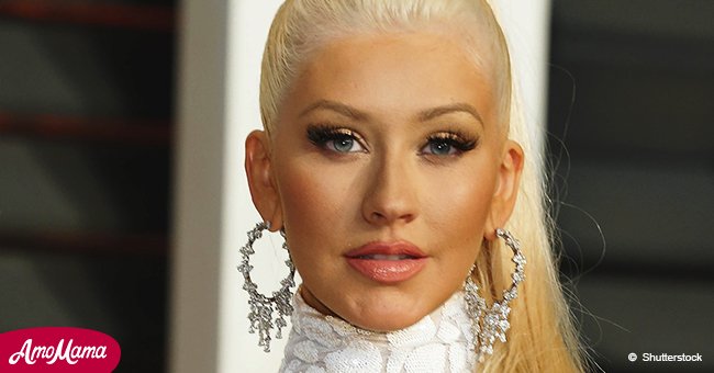 Christina Aguilera sports expensive slides at LAX after revealing secret crushes form her past