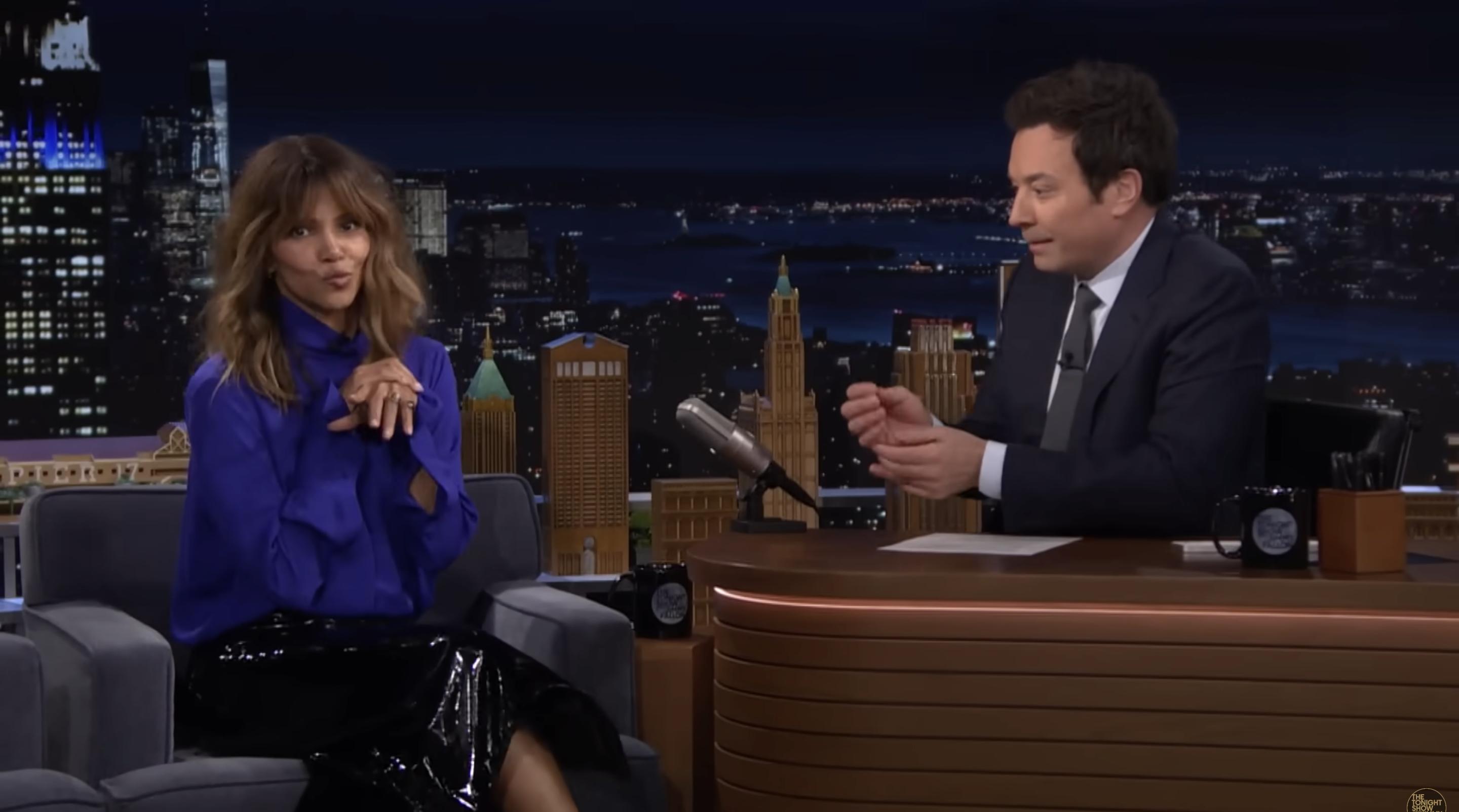 Halle Berry gestures while speaking with host Jimmy Fallon during her appearance on "The Tonight Show with Jimmy Fallon" | Source: YouTube/fallontonight