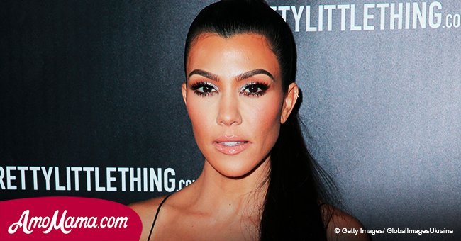 Kourtney Kardashian shares a new photo of herself in a see-through lace top that shows her bra