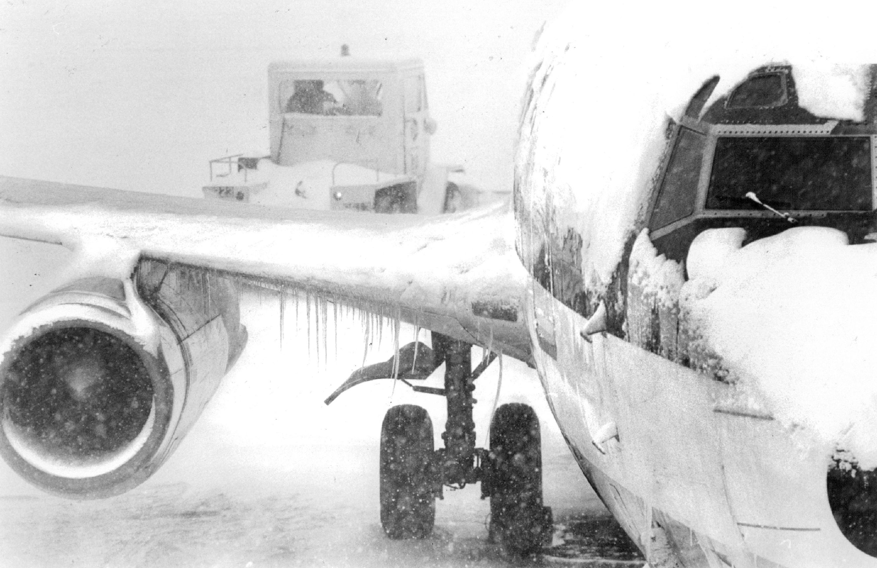 Icicles form on a snow covered jet after an airport closed due to low visibility in the snowstorm | Source: Getty Images