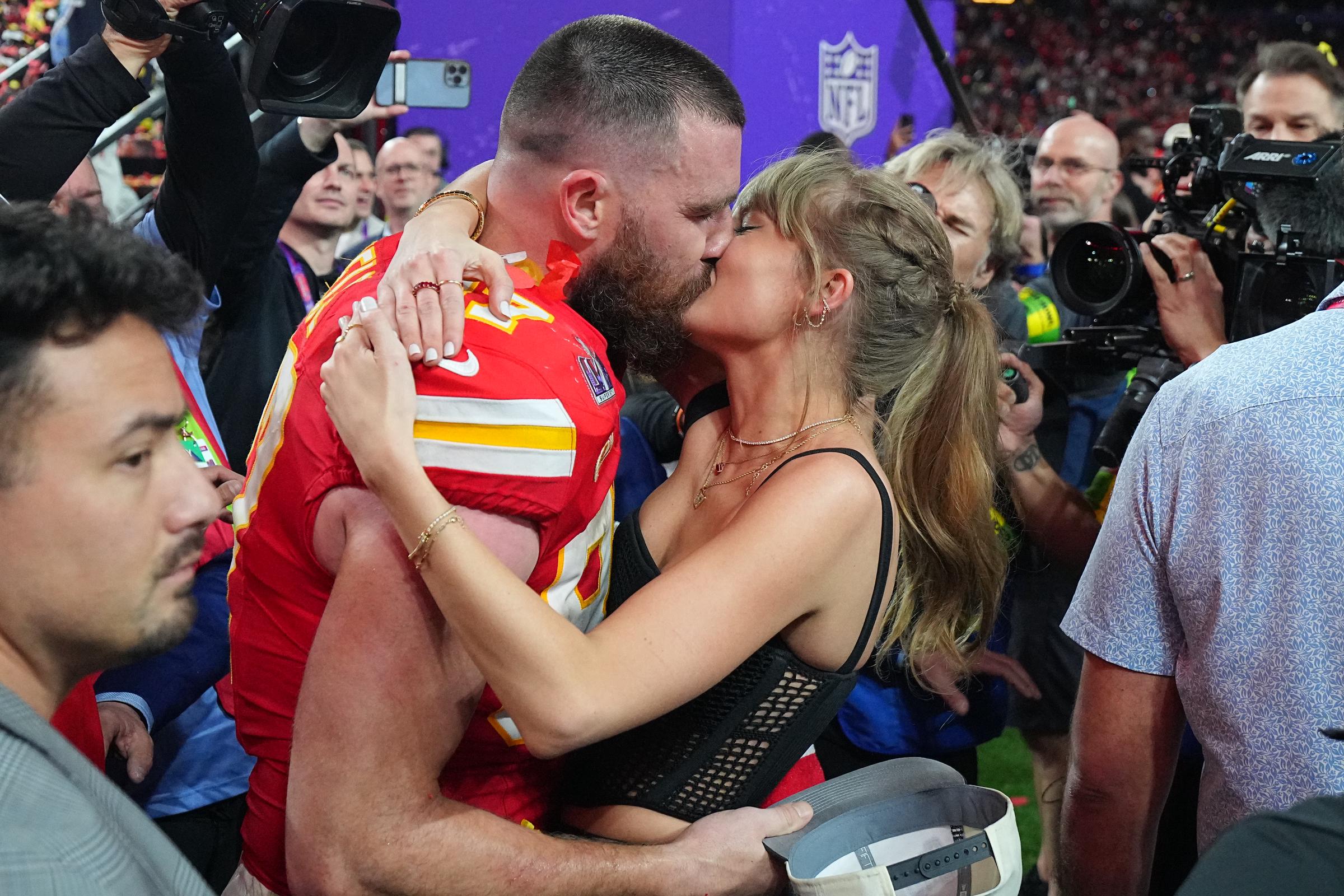 Travis Kelce kisses Taylor Swift after the Kansas City Chiefs win Super Bowl LVIII on February 11, 2024 | Source: Getty Images