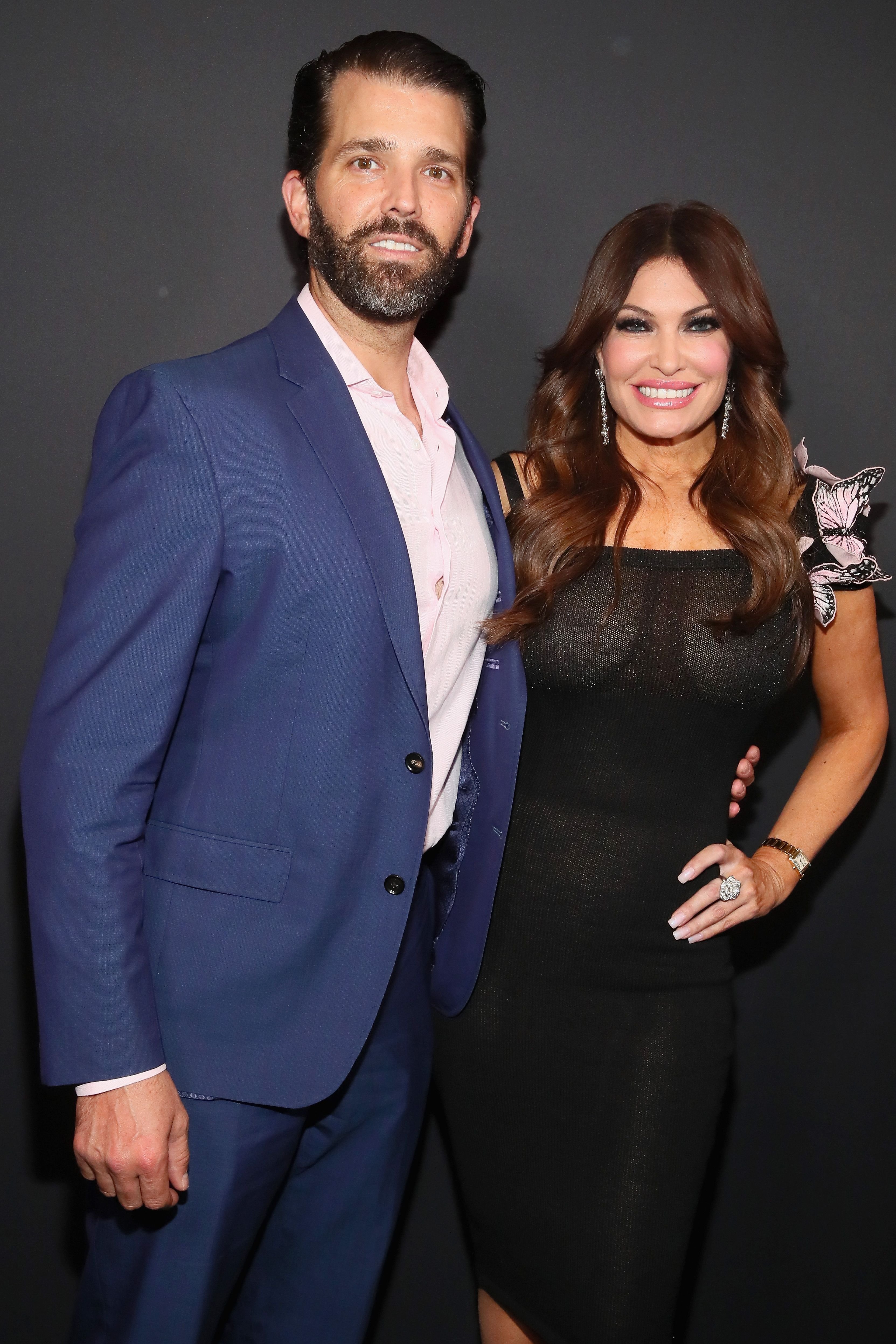 Kimberly Guilfoyle and Donald Trump Jr posing backstage for the Zang Toi fashion show during the New York Fashion Week at Spring Studios in New York City | Photo: Astrid Stawiarz/Getty Images for NYFW: The Shows