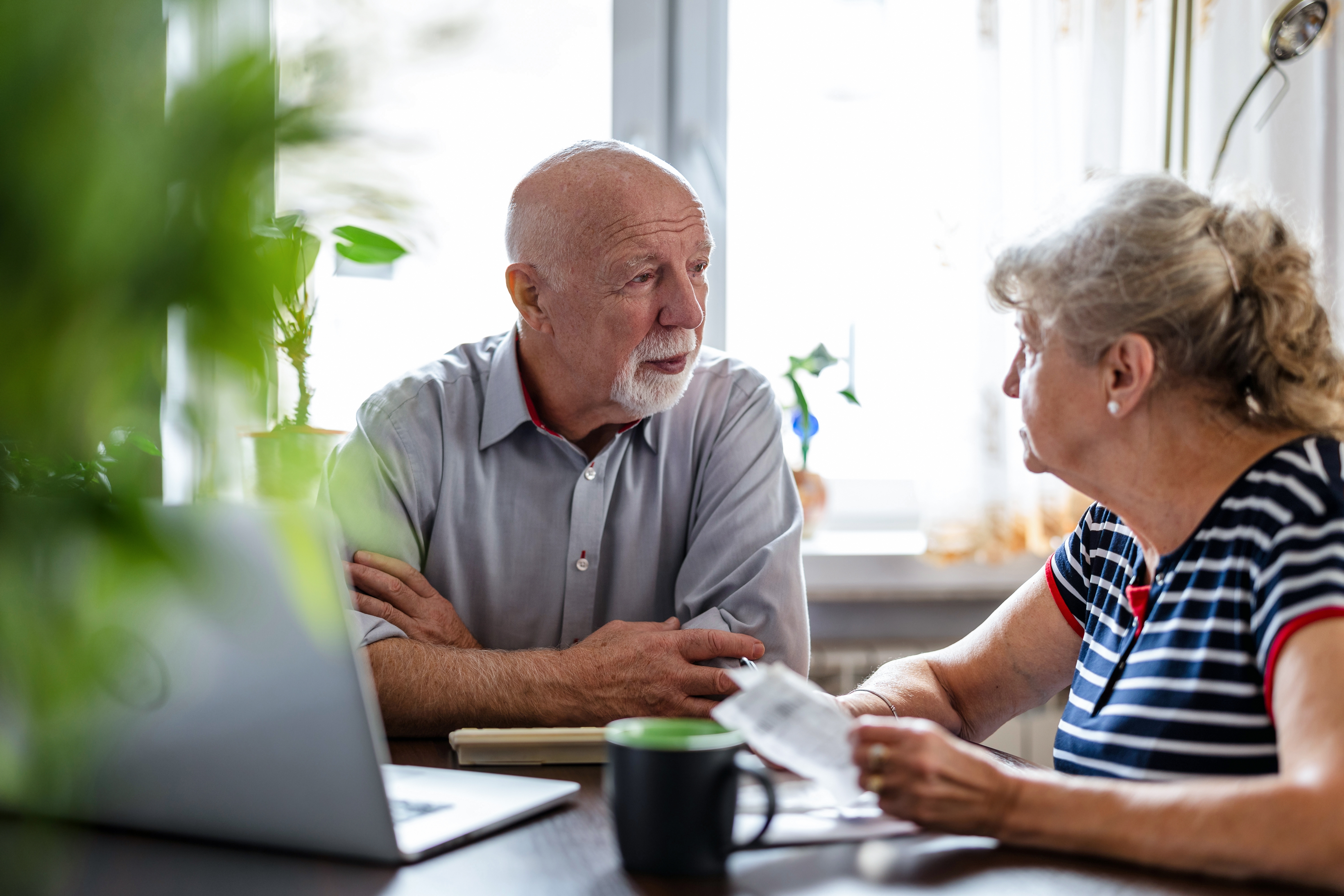 An elderly couple having a discussion | Source: Shutterstock