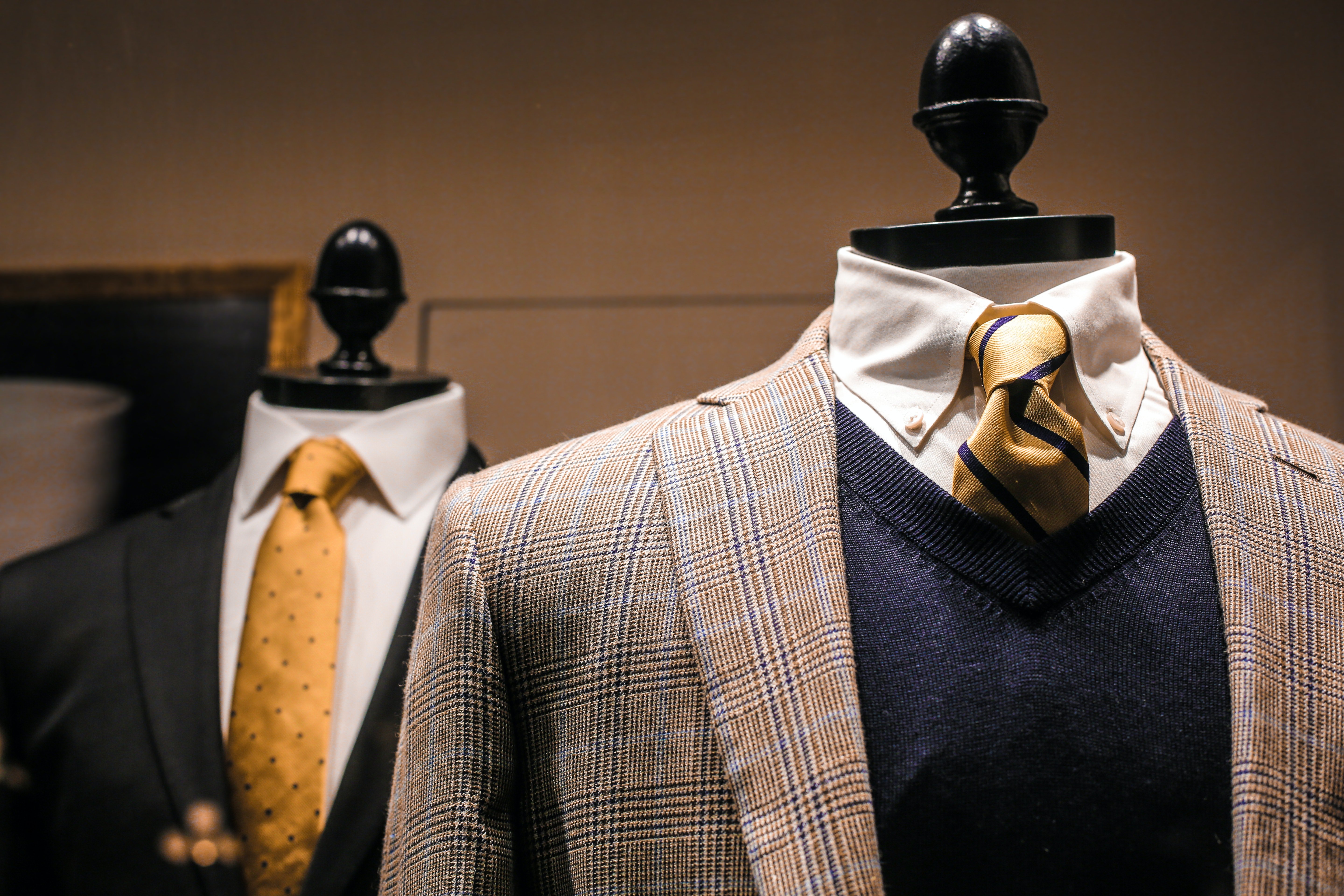 Pictured - Male outfits on dummies in a modern boutique | Source: Pexels 