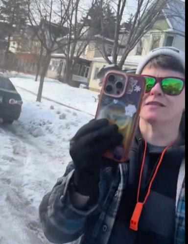 The woman who appears to be recording on her phone, from a video post dated January 9, 2026. | Source: YouTube/FoxNews