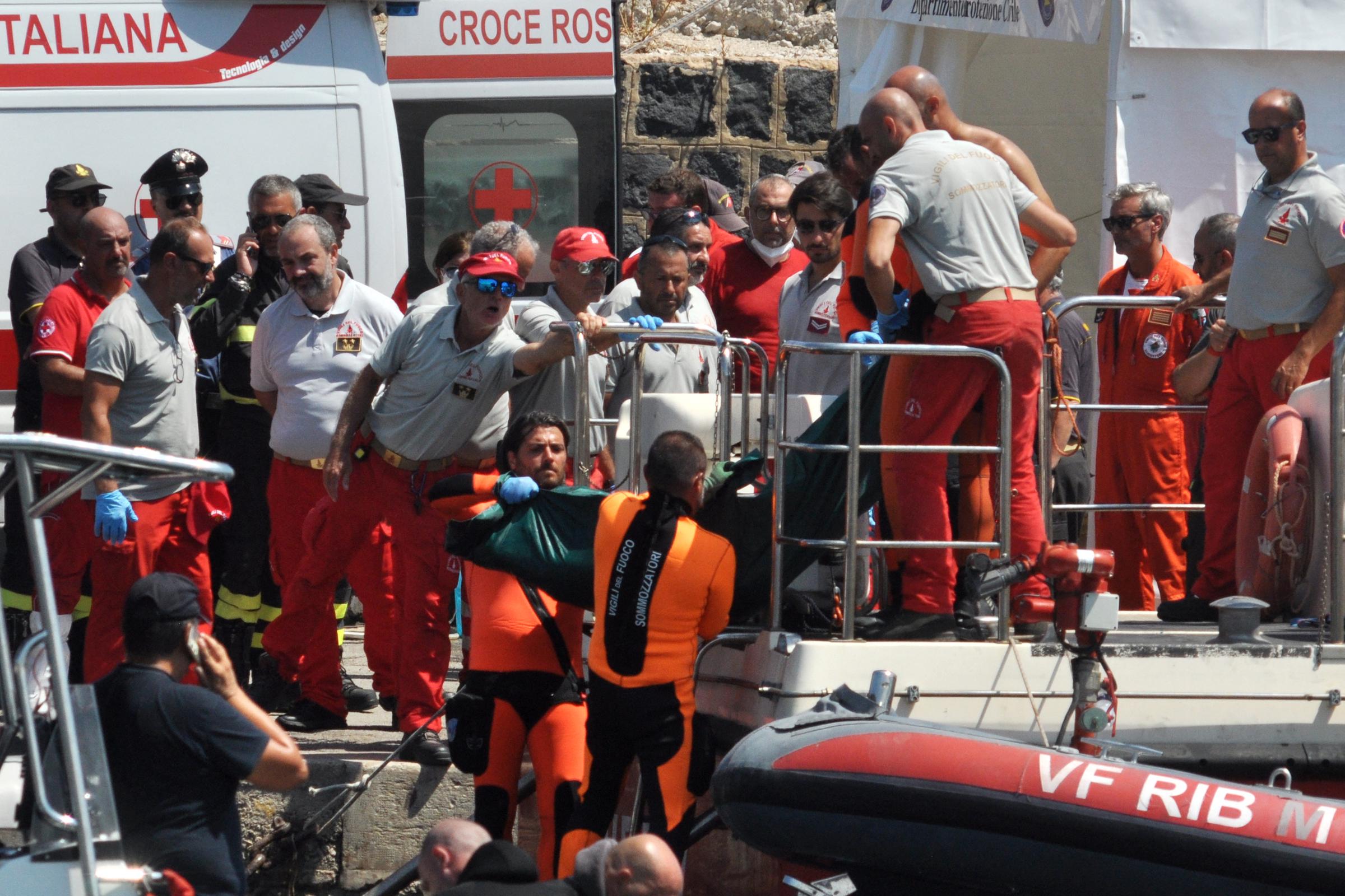 Divers of the Vigili del Fuoco, the Italian Corps. of Firefighters, carrying a body from the Bayesian yacht wreck at Porticello harbor, Italy, on August 23, 2024. | Source: Getty Images