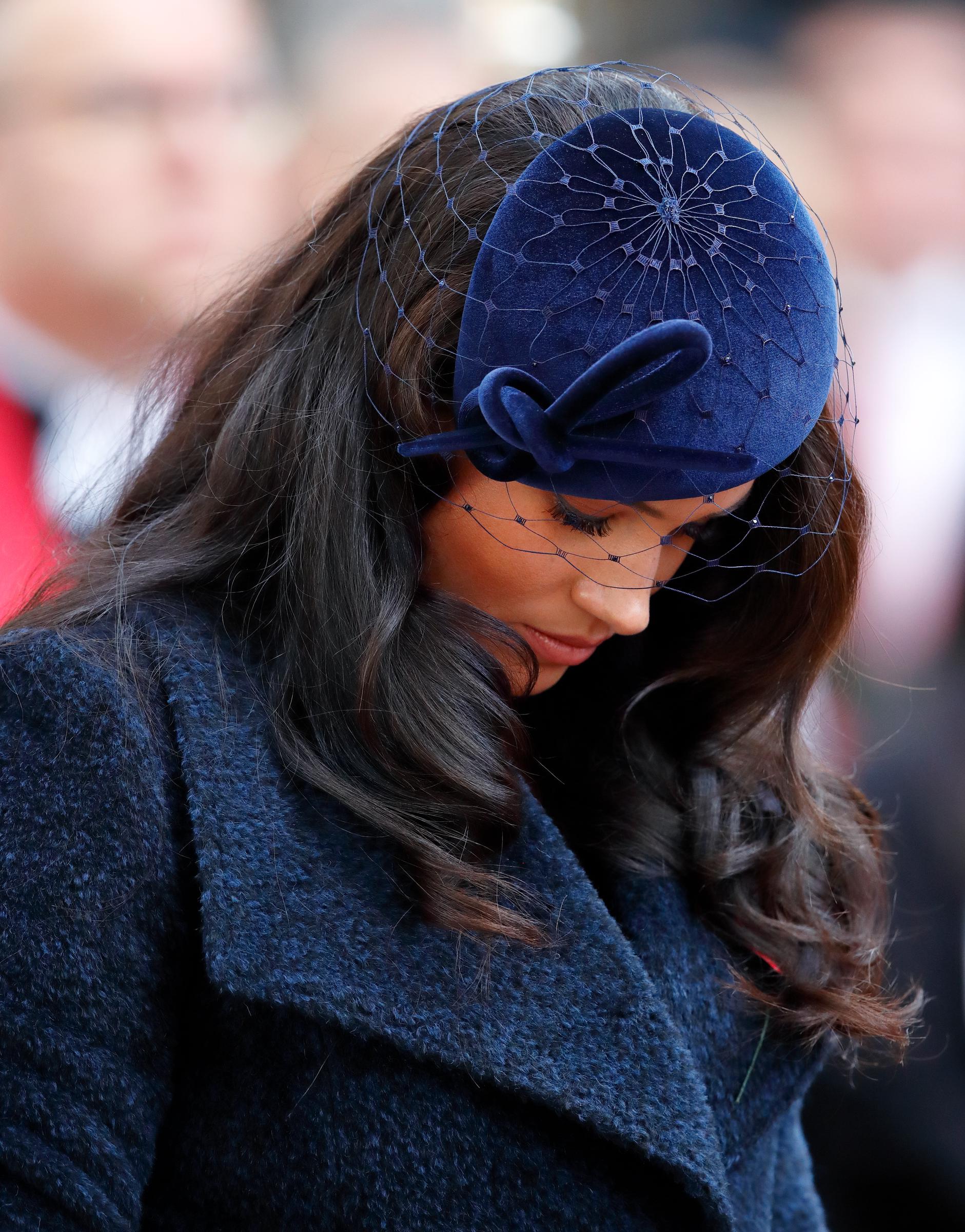 Meghan Markle bows her head as she attends the 91st Field of Remembrance at Westminster Abbey on November 7, 2019, in London, England. | Source: Getty Images