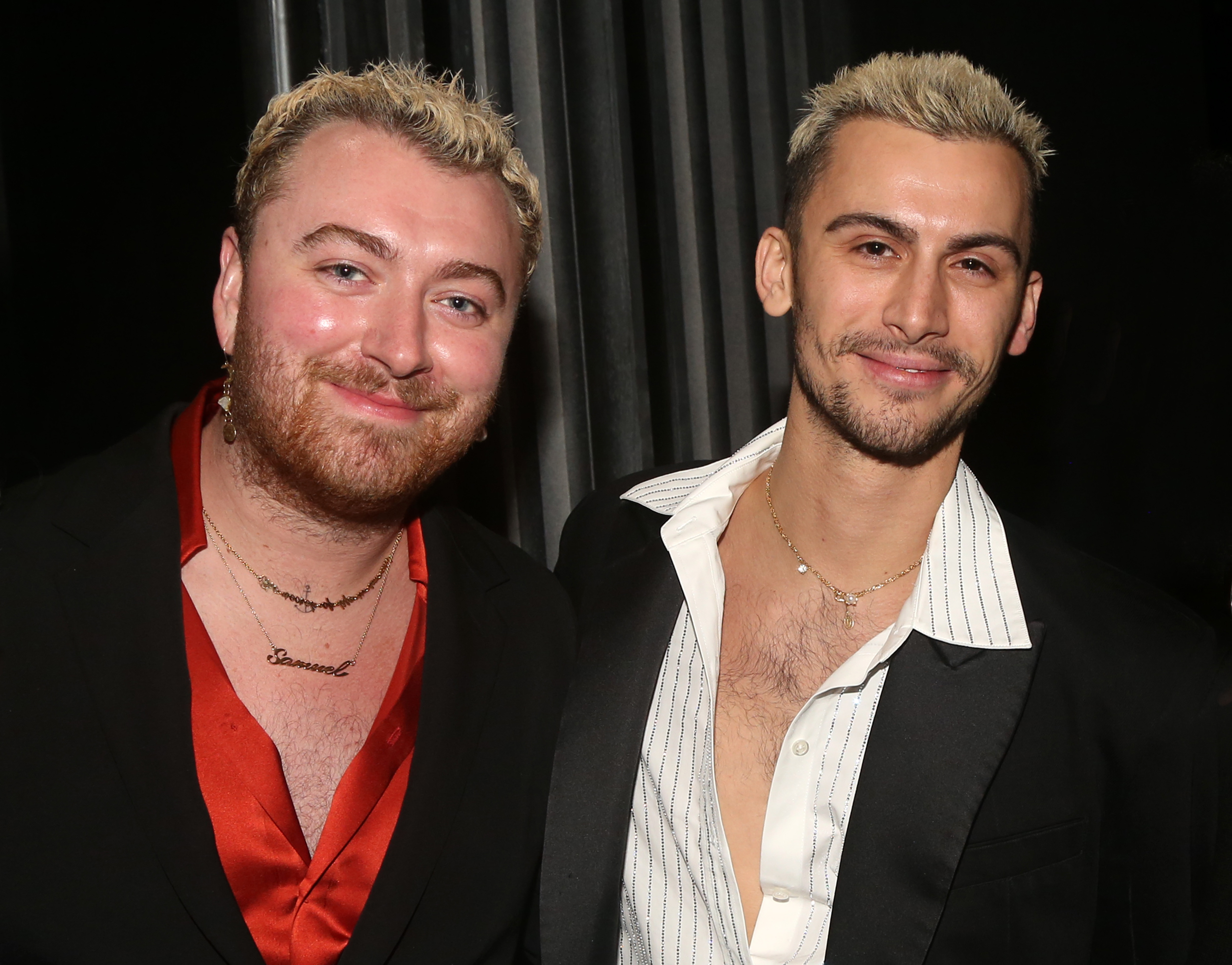 Sam Smith and partner Christian Cowan pose backstage at the musical "Some Like it Hot" on Broadway at The Shubert Theater on February 17, 2023 in New York City | Source: Getty Images