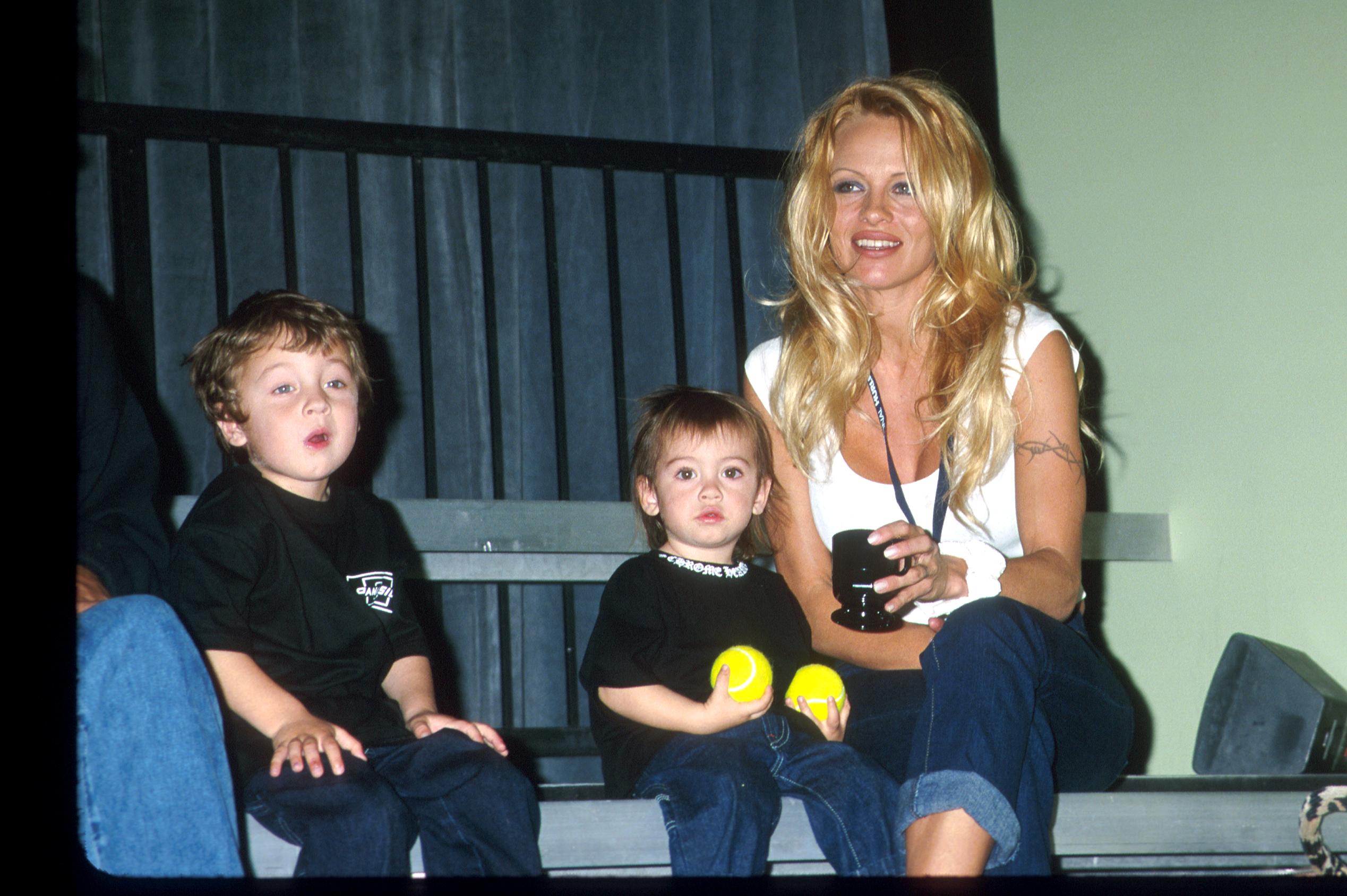 Pamela Anderson Lee with her kids Brandon & Dylan attending the Mtv's BALL2K a new interactive, futuristic game based on the skills of baseball | Photo:GettyImages