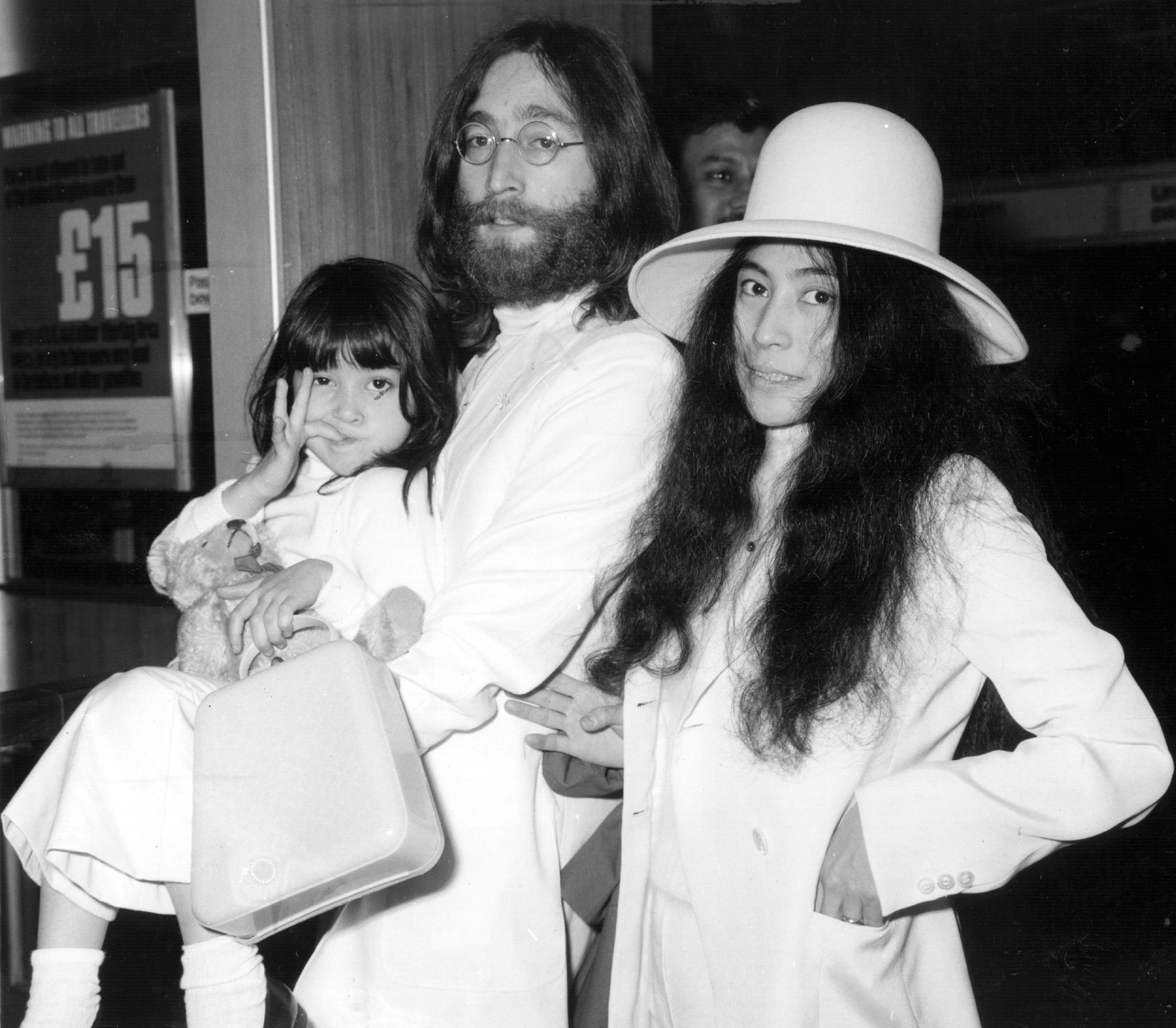 John Lennon and Yoko Ono at London's Heathrow airport with Kyoko in 1969 | Source: Getty Images