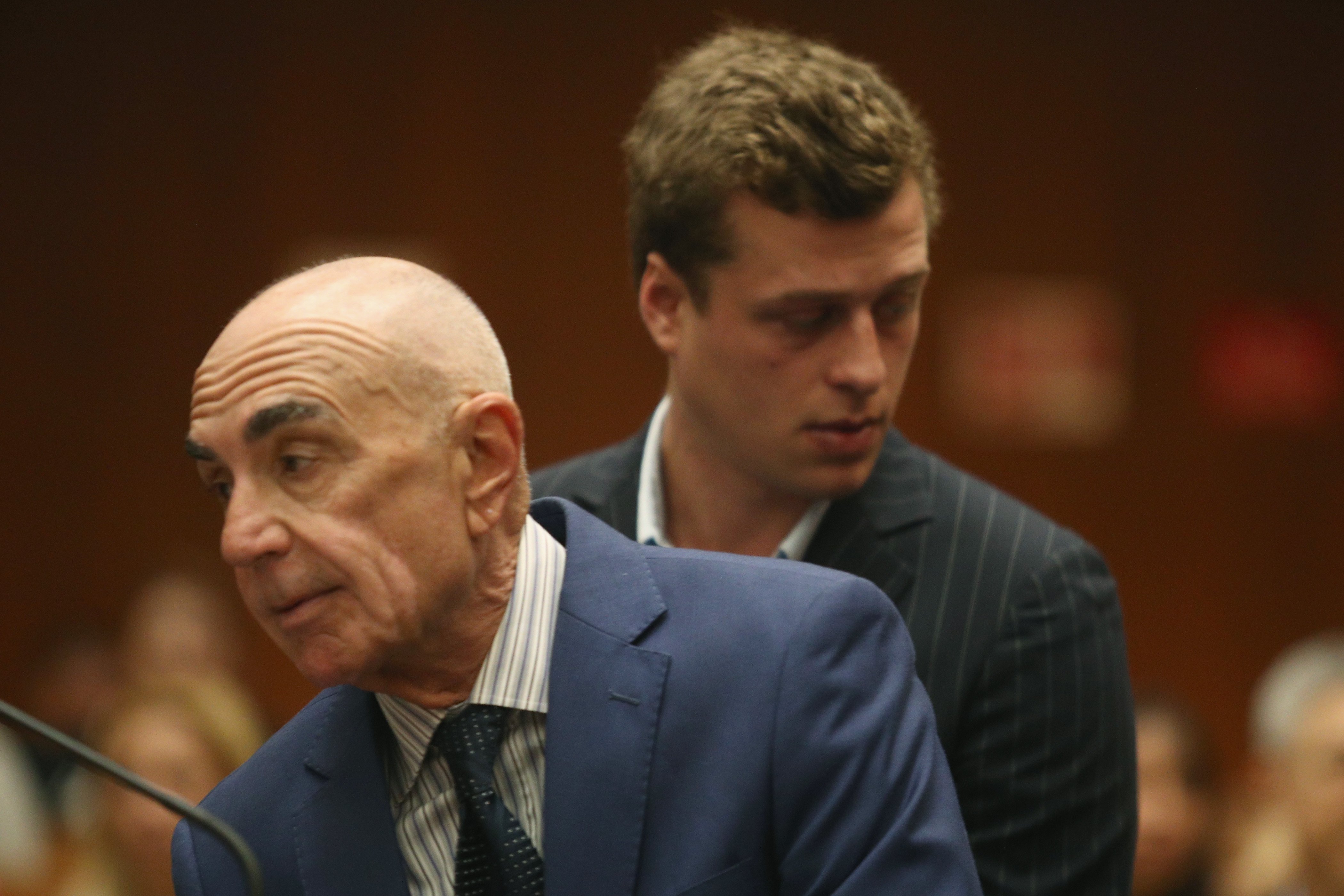 Attorney Robert Shapiro (front) and Conrad Hilton at Hilton's arraignment at Clara Shortridge Foltz Criminal Justice Center on June 29, 2017, in Los Angeles, California. | Source: Getty Images