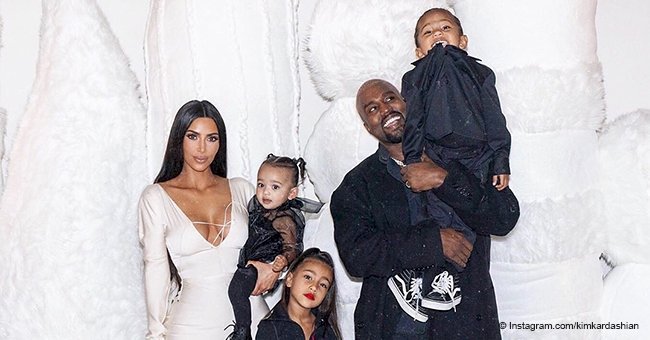 Kim Kardashian & Kanye West pose with their 3 kids in pic from their Christmas eve party