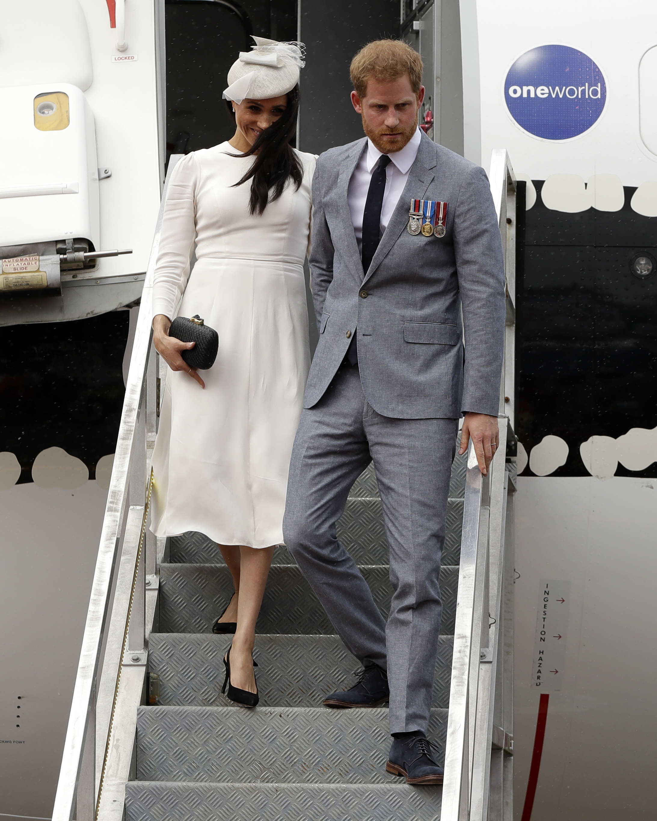 Meghan Markle and Prince Harry disembark from their plane on their arrival in Suva on October 23, 2018 in Suva, Fiji | Source: Getty Images