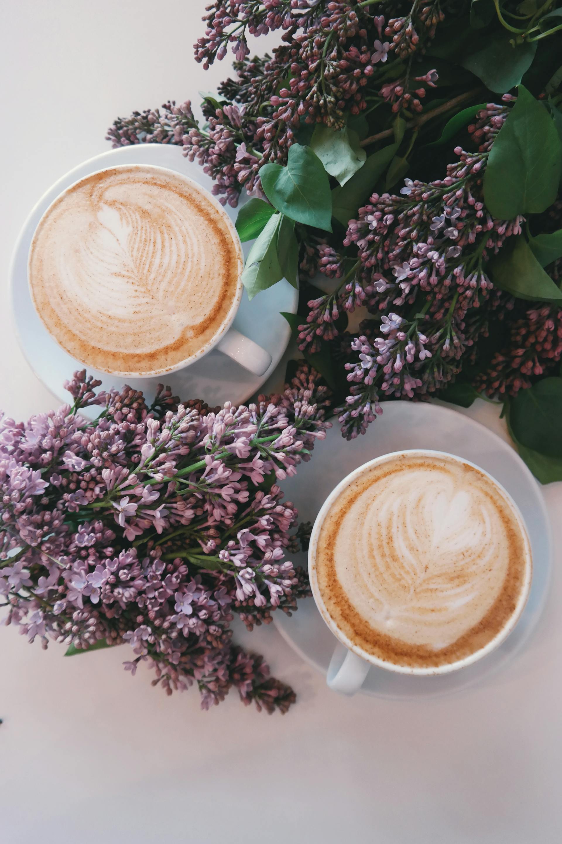 Two lattes on a table | Source: Pexels