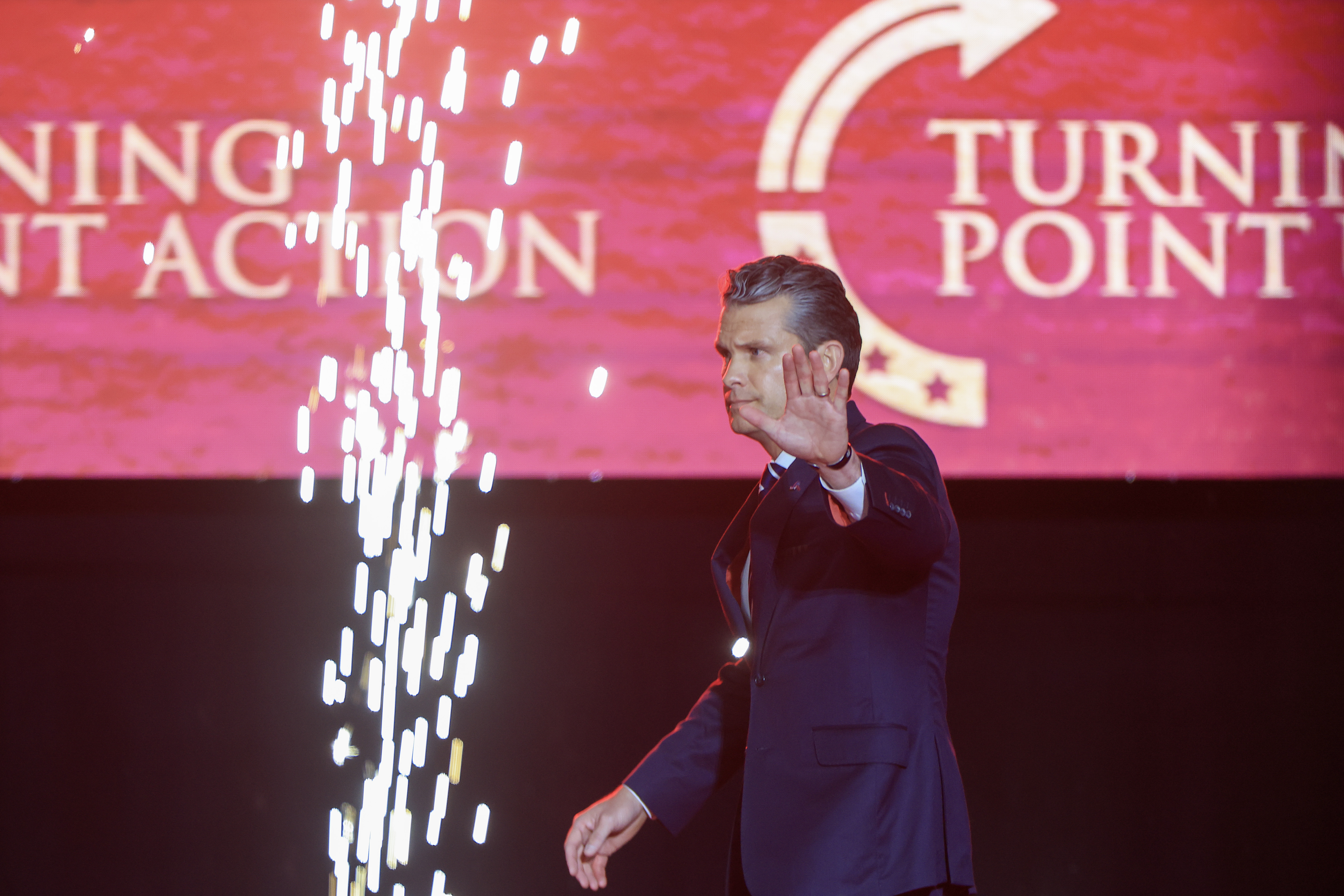 U.S. Secretary of War Pete Hegseth onstage during the public memorial service for Charlie Kirk at State Farm Stadium on September 21, 2025 | Source: Getty Images