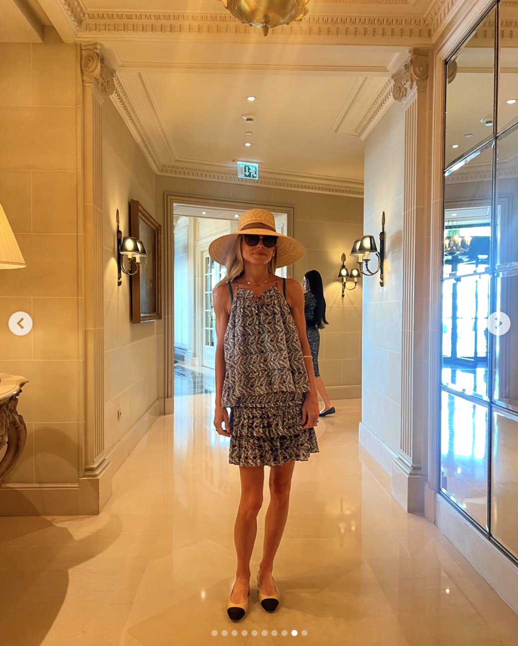 Kelly Ripa wearing a swimsuit cover-up and a hat, as seen in a photo dated June 30, 2024 | Source: Instagram/instasuelos