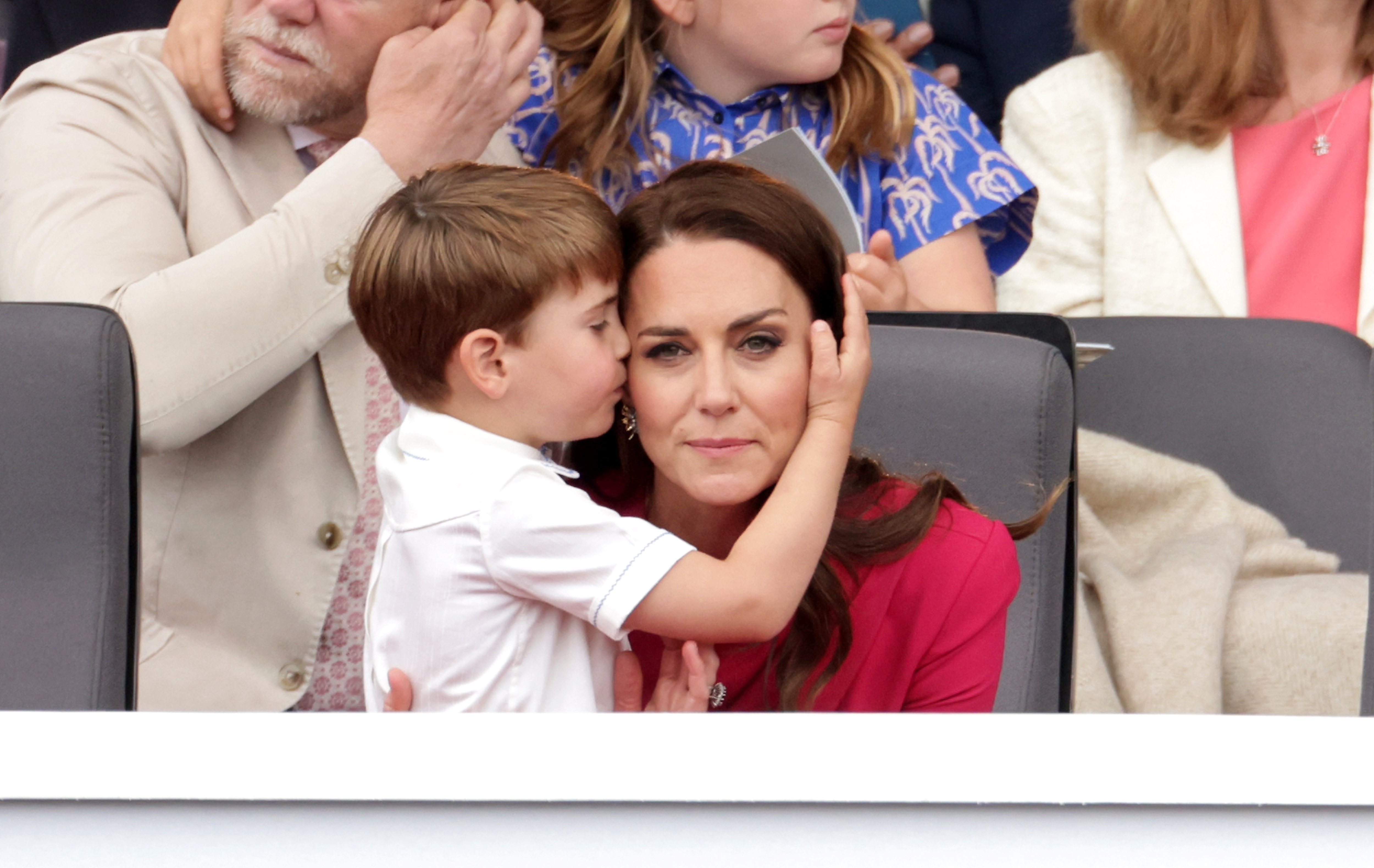 Prince Louis of Cambridge kiss Catherine, Duchess of Cambridge on her cheeks during the Platinum Pageant on June 05, 2022 in London, England. | Source: Getty Images