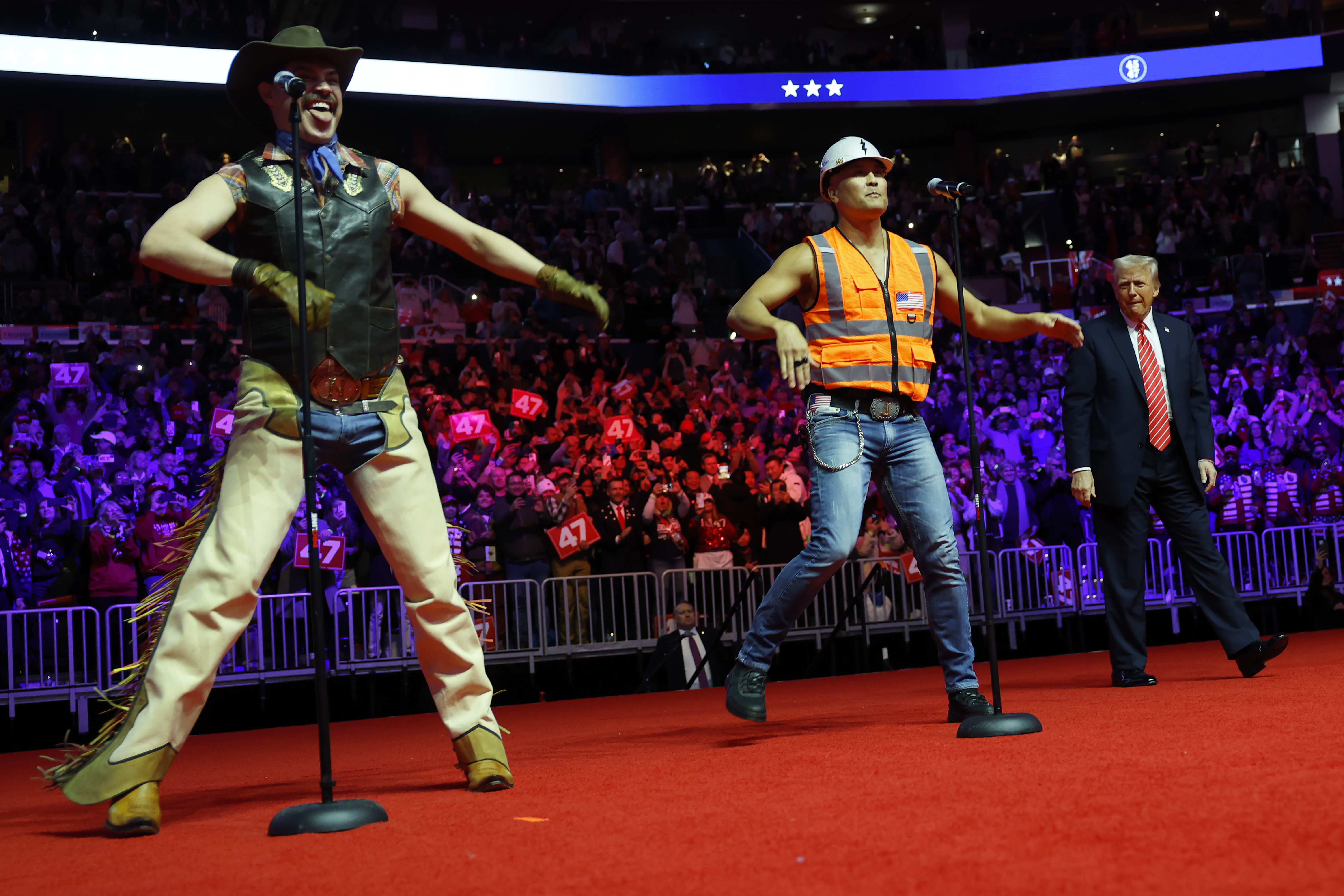 Donald Trump dances on stage while the Village People perform "YMCA" on stage at his victory rally at the Capital One Arena on January 19, 2025 in Washington, DC | Source: Getty Images