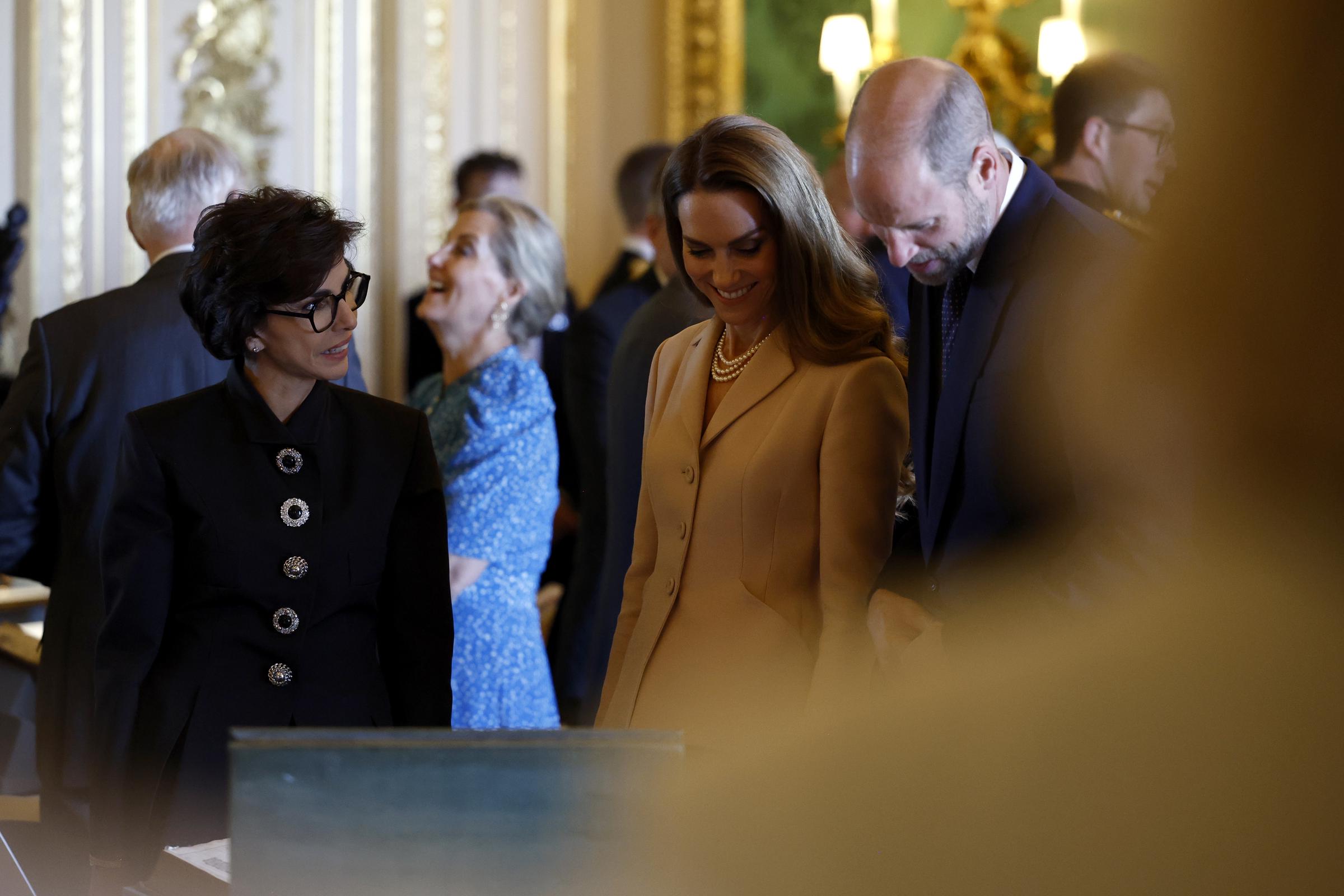 Princess Catherine and Prince William engaged in conversation with France's Minister of Culture, Rachida Dati, during a viewing of artwork from the Royal Collection at Windsor Castle.