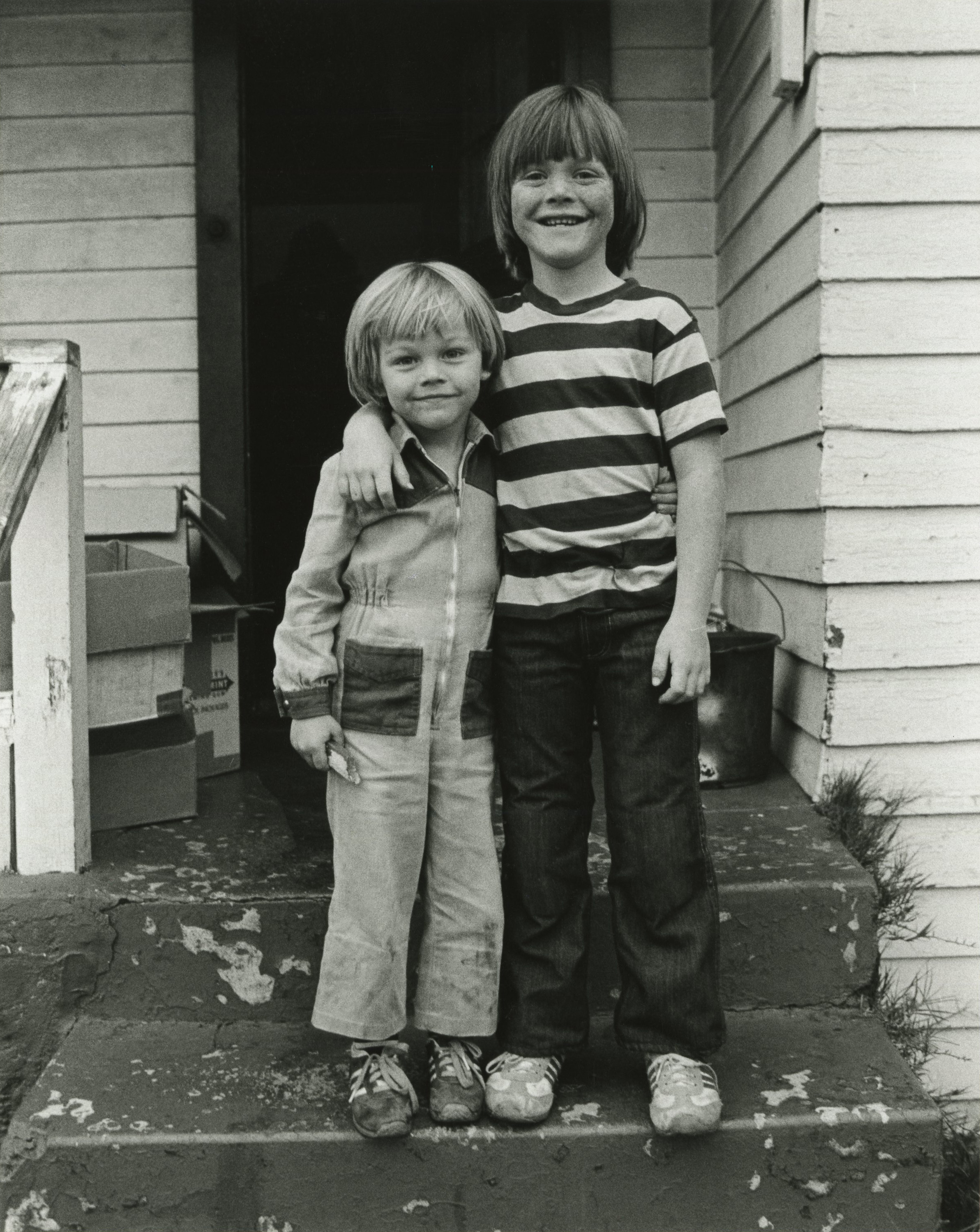 The young boy and his step-brother pose outside their house in July 1978 in Hollywood, California | Source: Getty Images