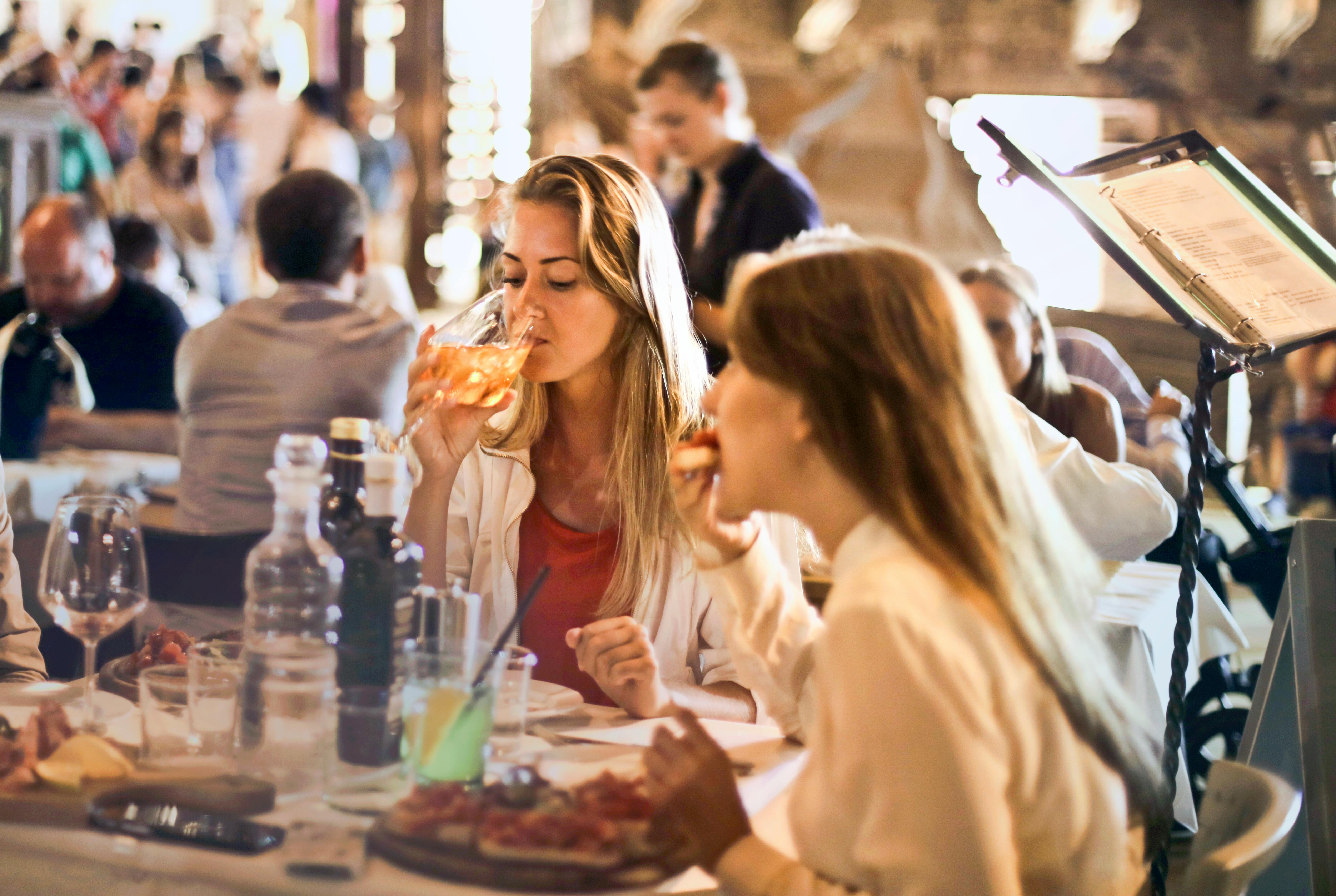 Two women eating in a restaurant | Source: Pexels