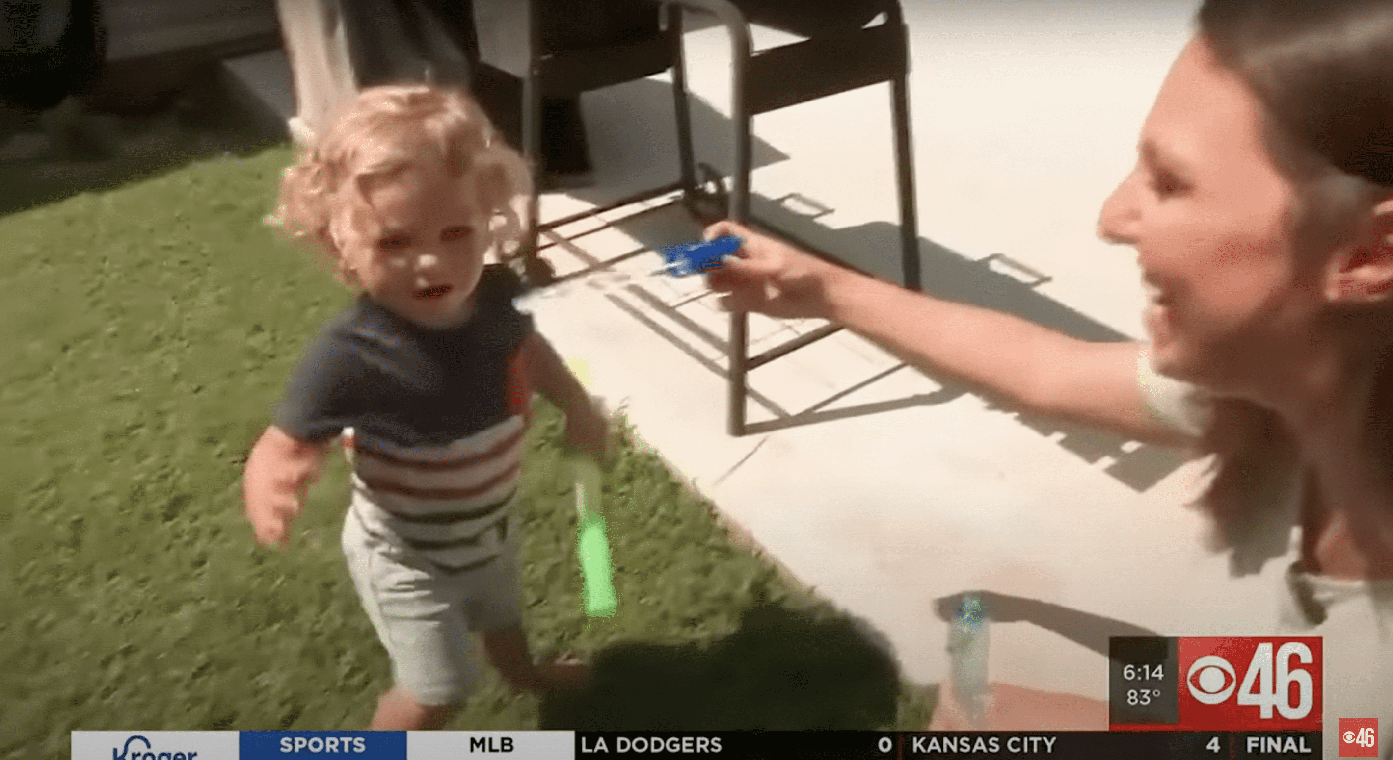 Ethan and his mom, Brittany, are pictured playing with bubbles. | Source: YouTube.com/CBS46 Atlanta