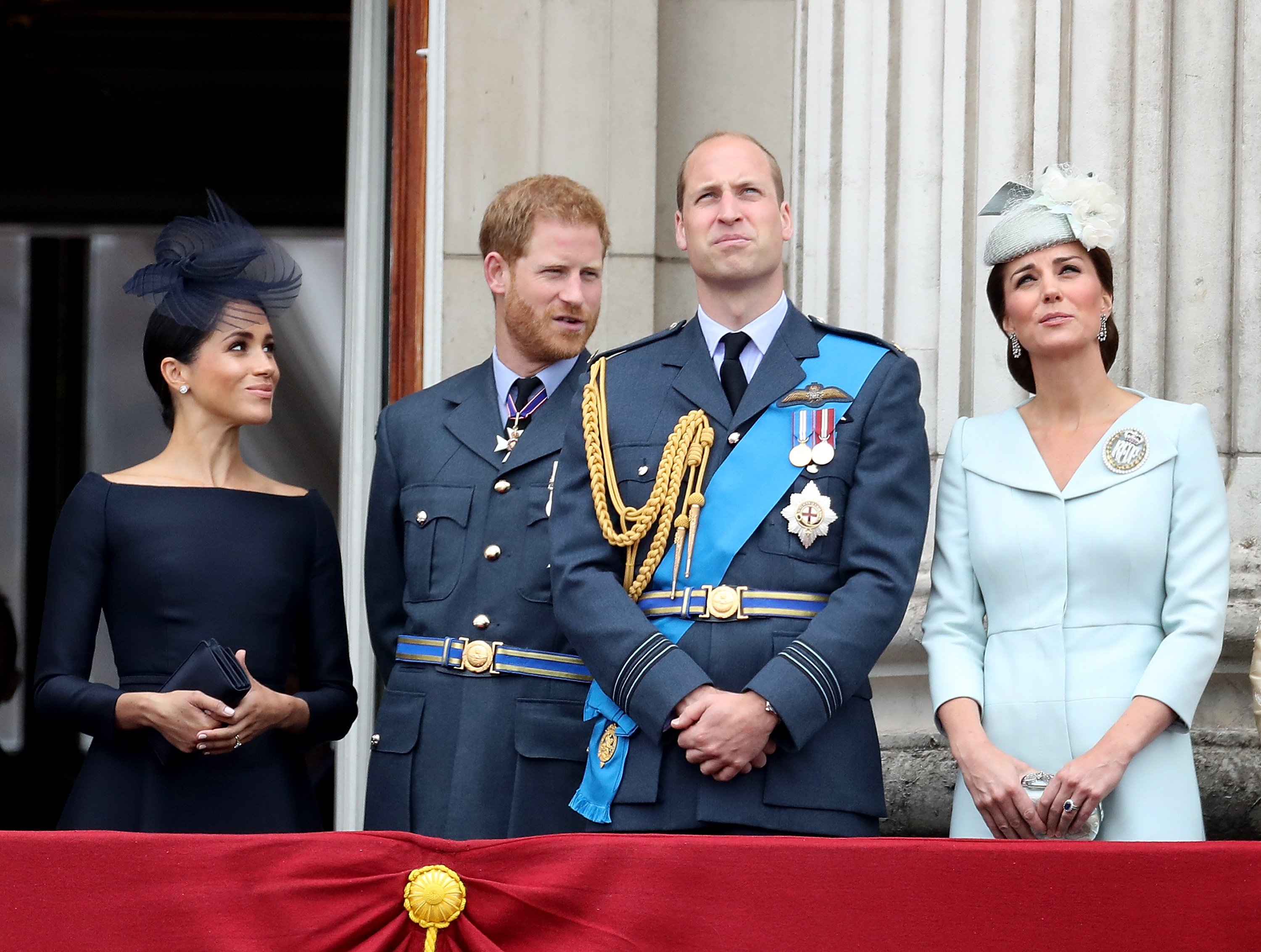 Duchess Meghan, Prince Harry, Prince William, and Duchess Kate watch the RAF flypast on the balcony of Buckingham Palace on July 10, 2018, in London, England. | Source: Getty Images