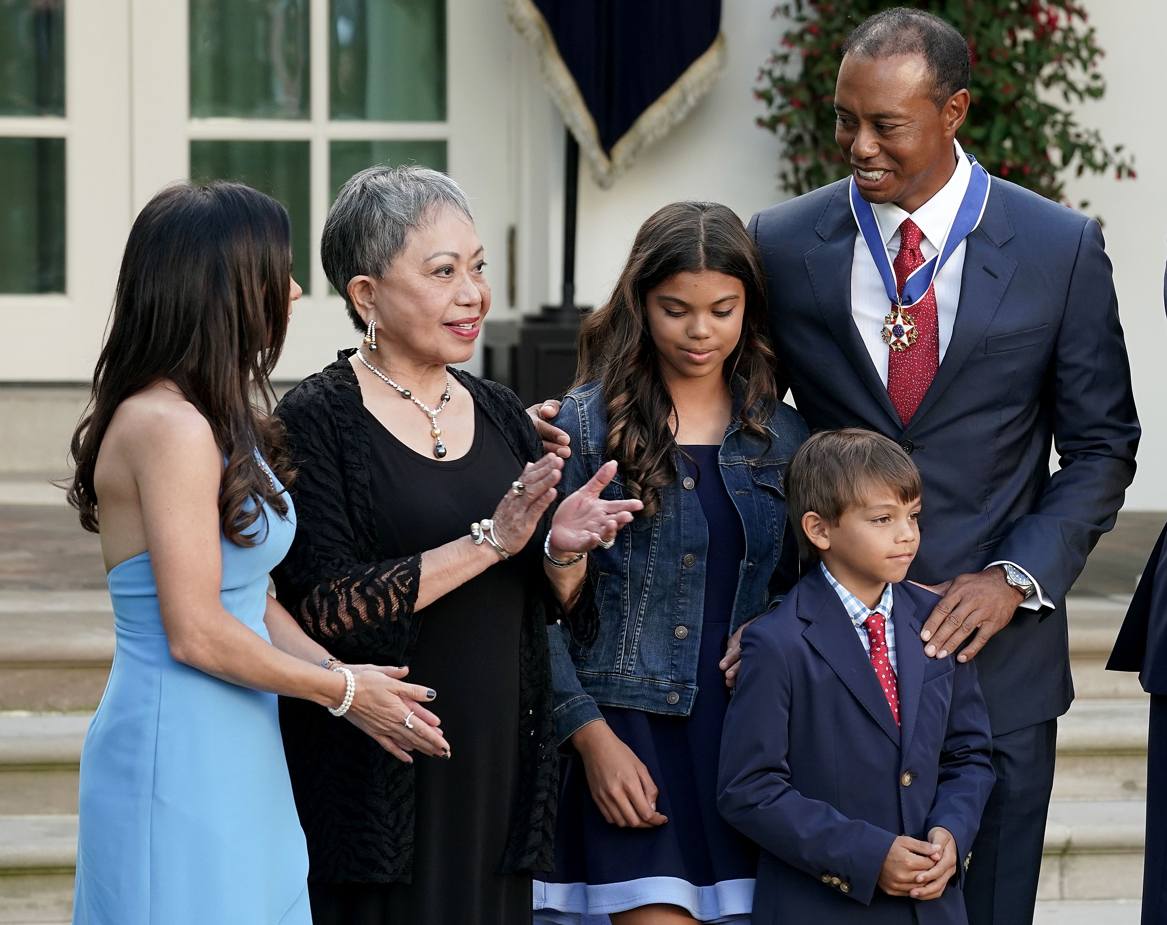 Tiger, Kultida, Sam Alexis, and Charlie Axel Woods alongside Erica Herman during Tiger's Medal of Freedom ceremony in the Rose Garden at the White House in Washington, Dc, on May 6, 2019. | Source: Getty Images