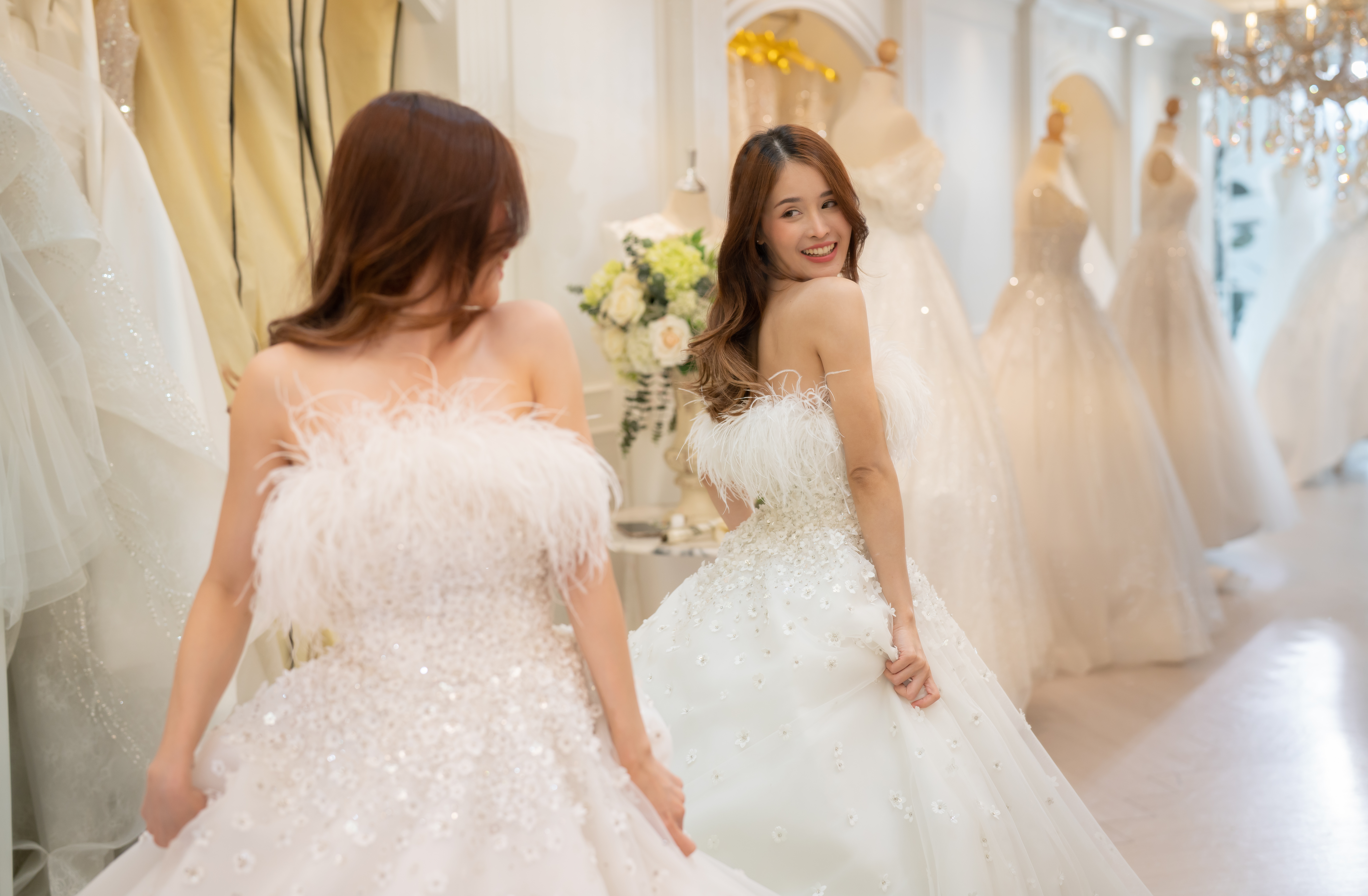 The tailor designs the wedding dress for the bride | Source: Getty Images