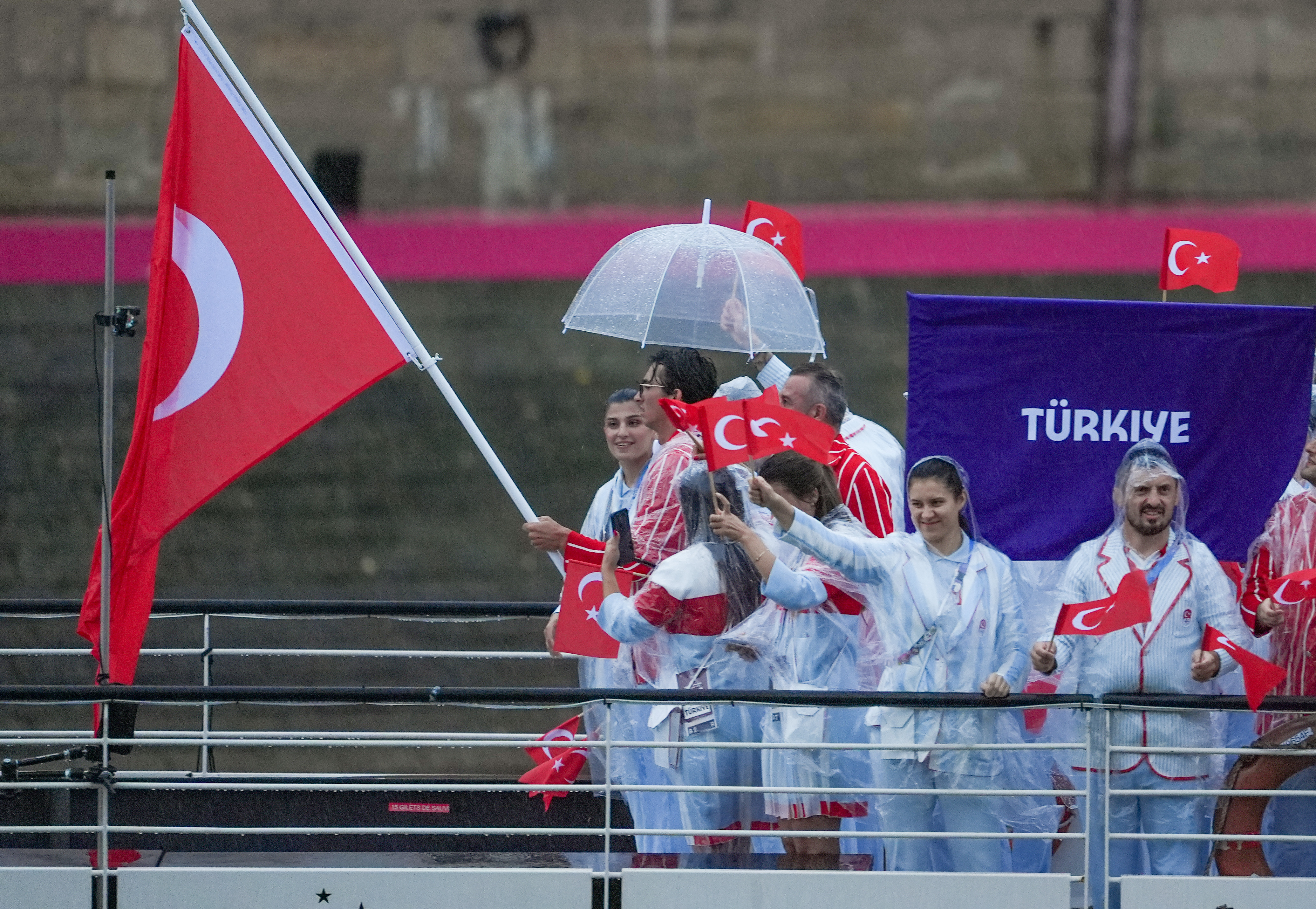 Athletes from Turkiye delegation sail in a boat along the River Seine as rain starts at the start of the opening ceremony of the Paris 2024 Olympic Games in Paris, France, on July 26, 2024. | Source: Getty Images