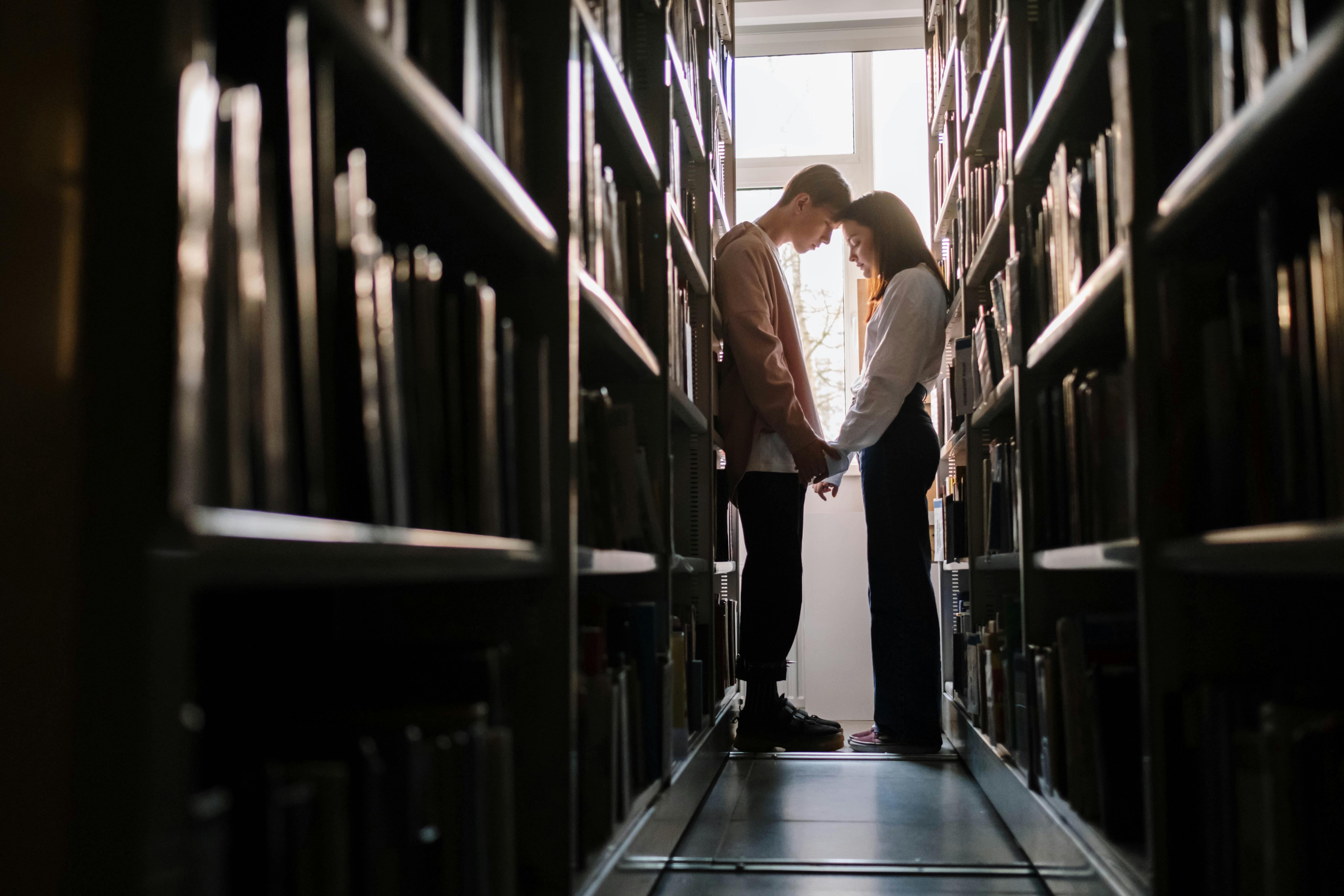 A couple meeting at a library | Source: Pexels