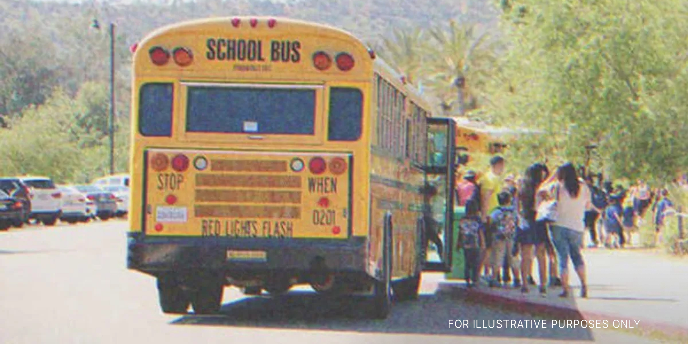 A school bus picking up a group of kids | Source: Shutterstock