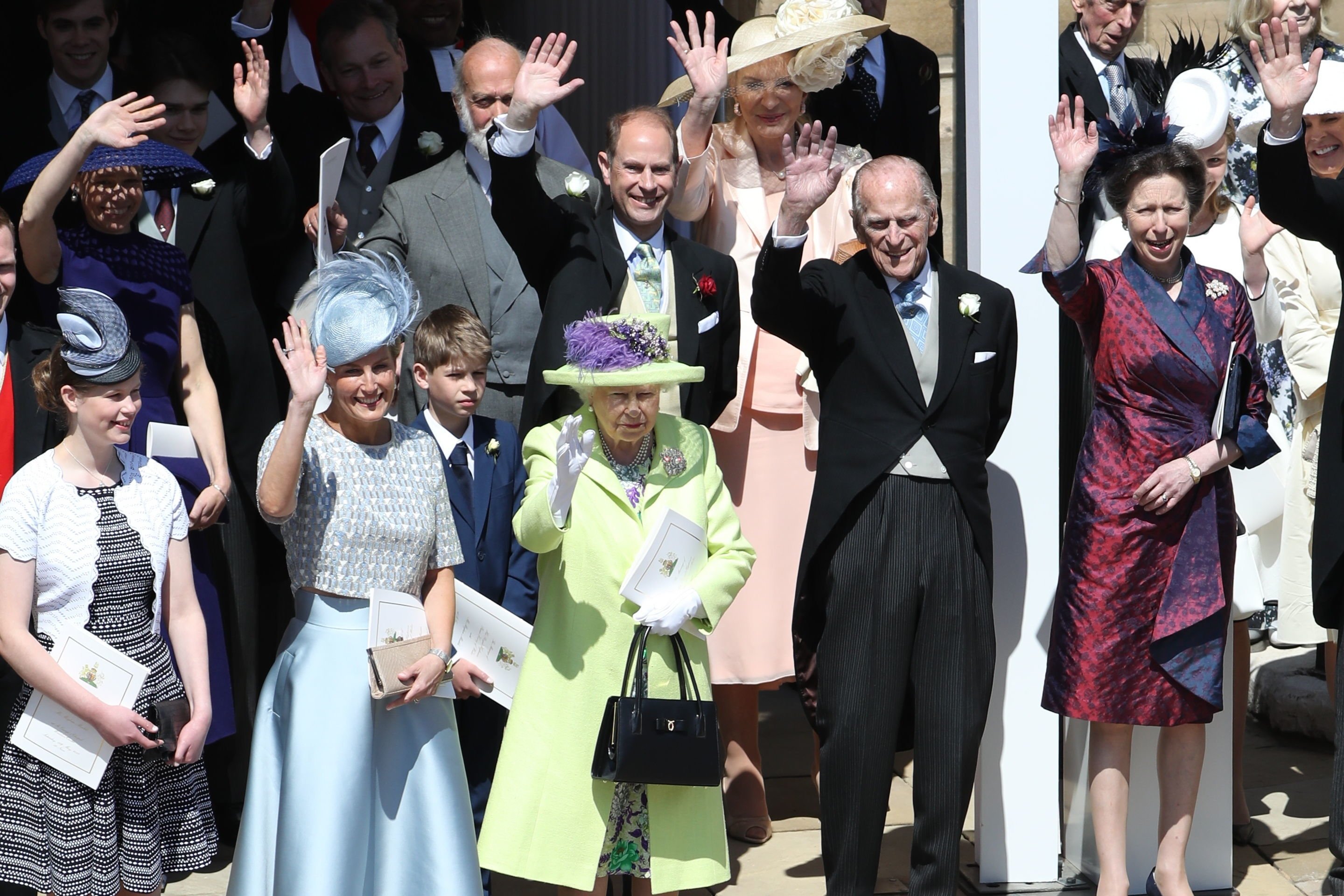 Lady Louise Windsor, Sophie, Countess of Wessex, James, Viscount Severn, Queen Elizabeth II, Prince Michael of Kent, Prince Edward, Prince Philip, Princess Anne, Princess Royal wave after the wedding of Prince Harry and Meghan Markle at St George's Chapel in Windsor Castle on May 19, 2018 in Windsor, England | Source: Getty Images