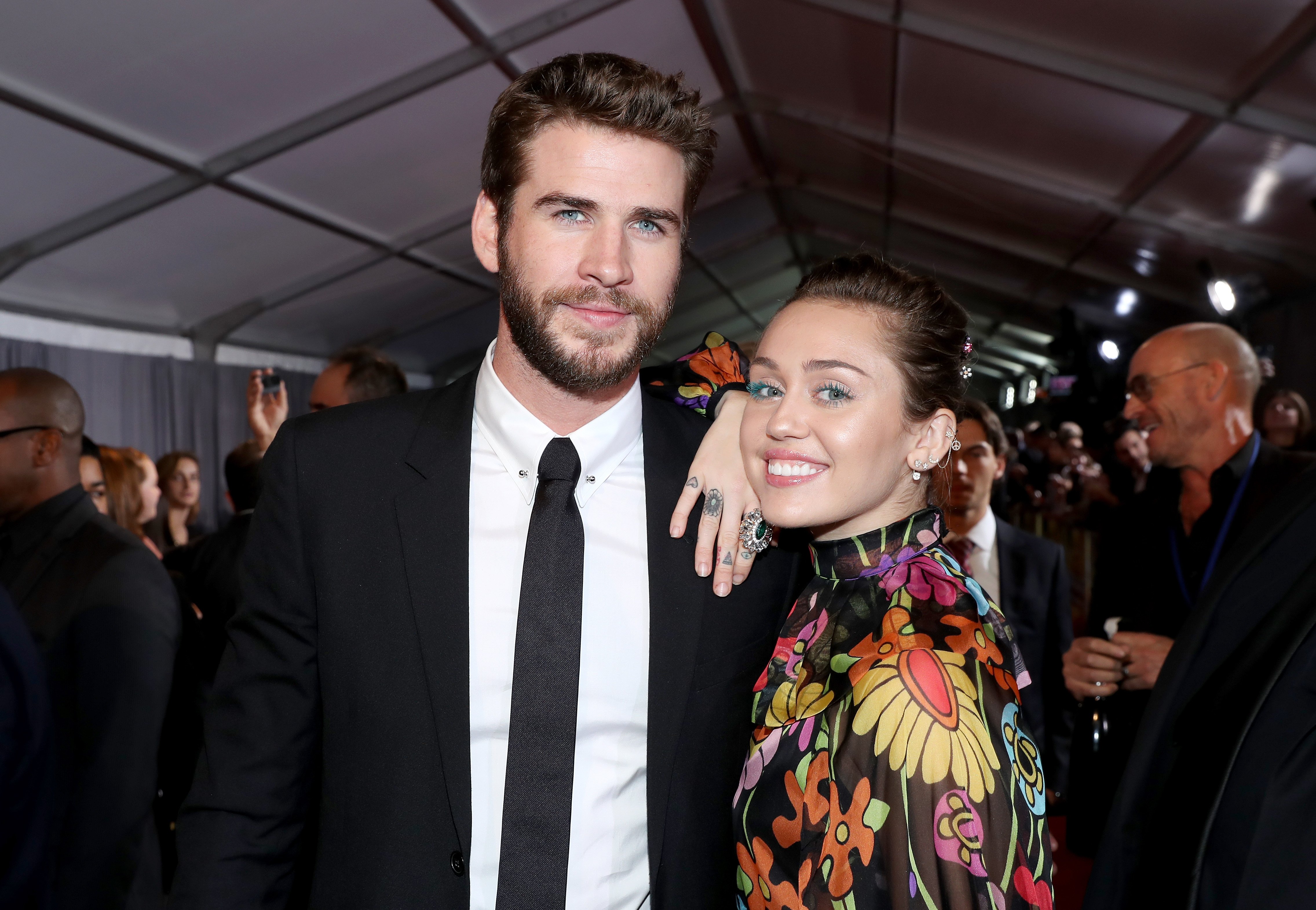 Actor Liam Hemsworth (L) and Miley Cyrus at The World Premiere of Marvel Studios' "Thor: Ragnarok" at the El Capitan Theatre on October 10, 2017, in Hollywood, California. | Source: Getty Images.