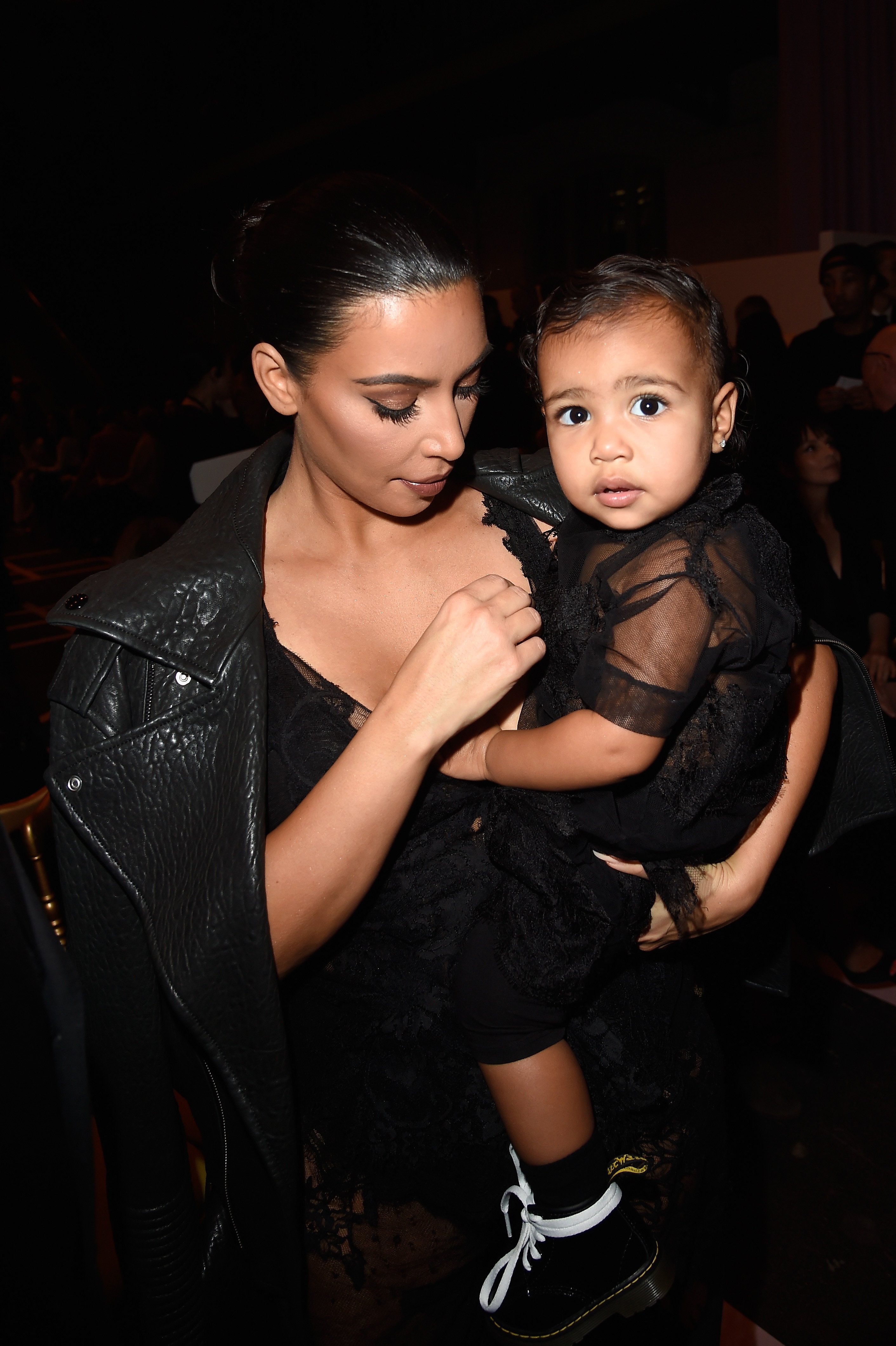 Kim Kardashian and North West attend the Givenchy show as part of the Paris Fashion Week Womenswear Spring/Summer 2015 on September 28, 2014. | Source: Getty Images