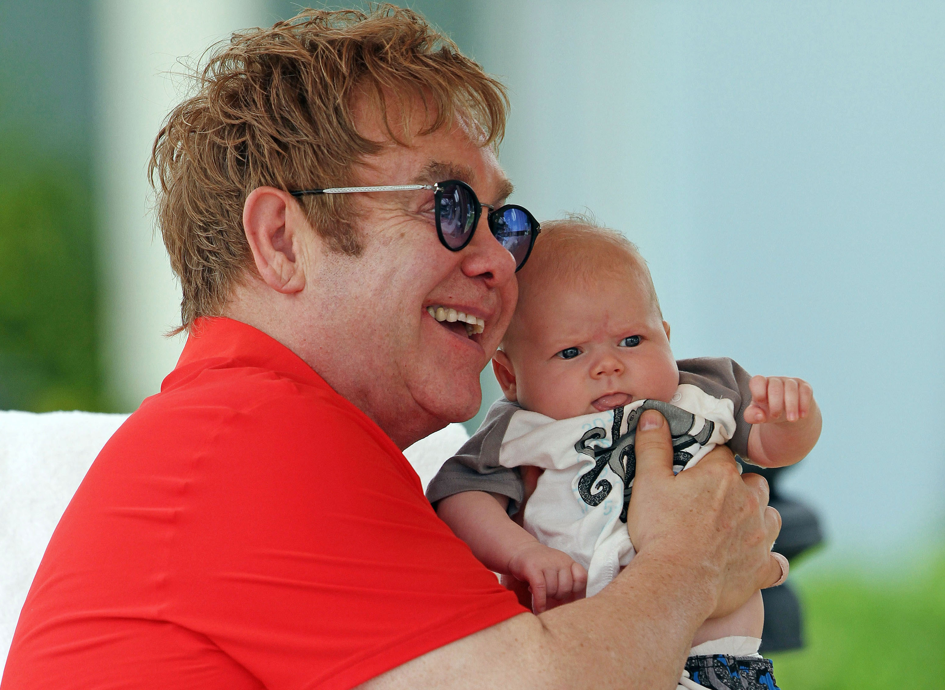 Elton John and baby Zachary in Honolulu, Hawaii. in 2011 | Source: Getty Images