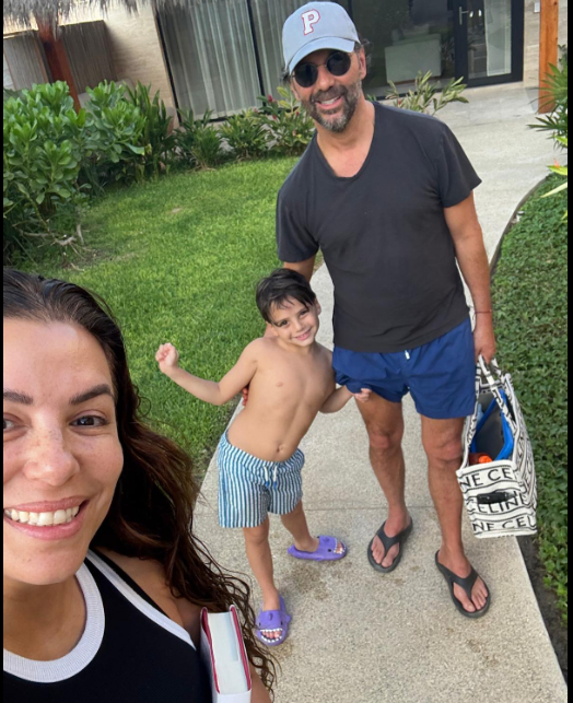 Eva Longoria posing for a snap with her husband, José Bastón, and their son, Santiago. | Source: Facebook/Eva Longoria Baston