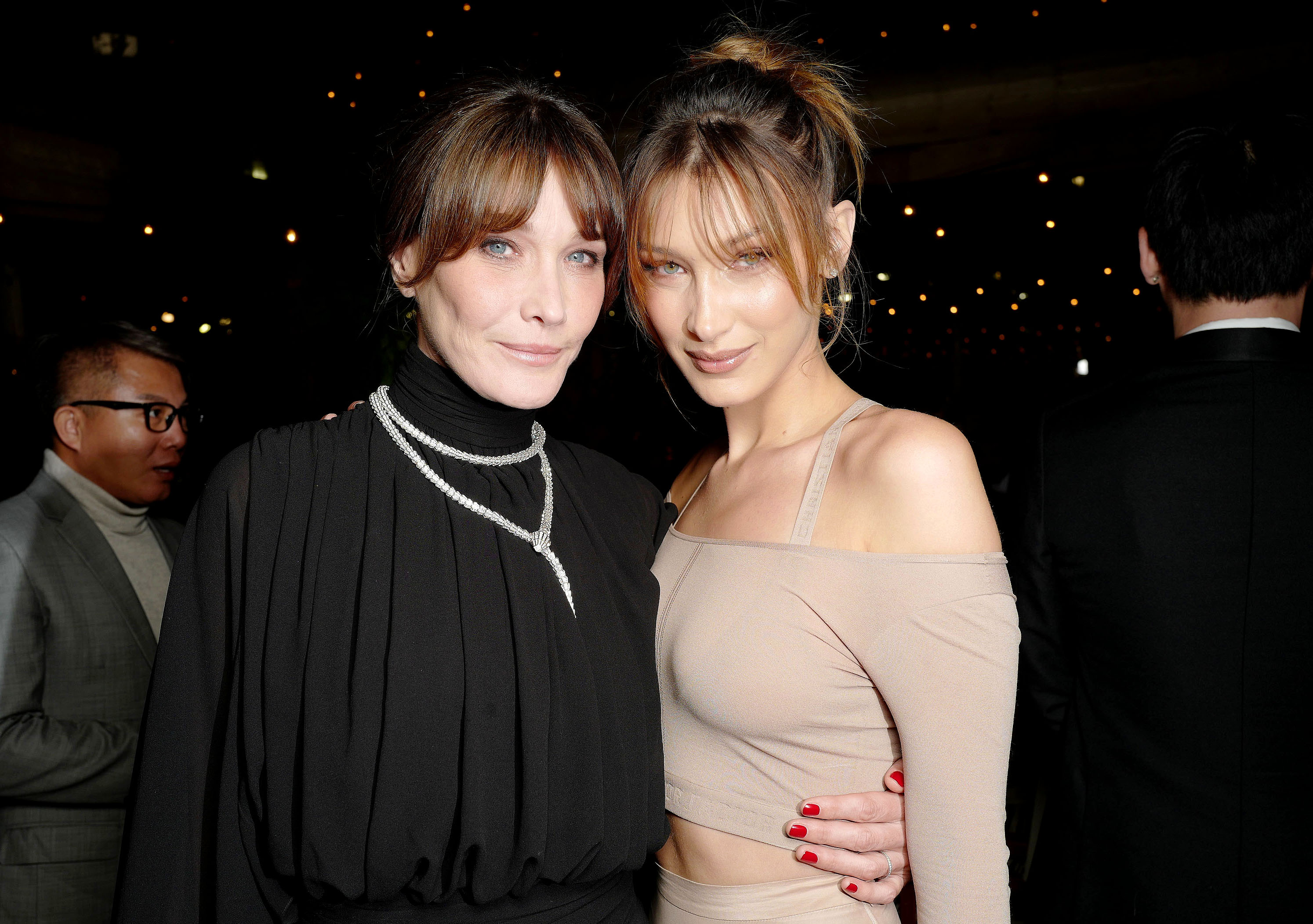 Carla Bruni-Sarkozy and Bella Hadid attend the Dior x Vogue Dinner during the Cannes Film Festival in France on May 15, 2019. | Source: Getty Images