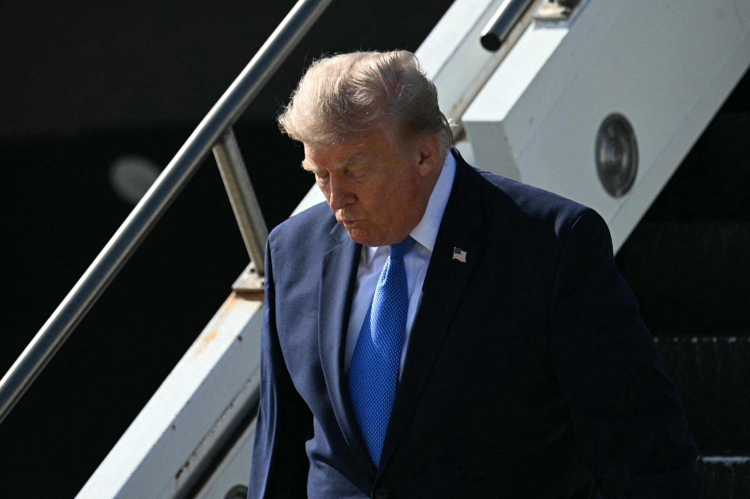 A closer angle showed Trump's light-blond hair lying lower across the top of his head, with less lift at the front and gray tones visible along the sides. | Source: Getty Images