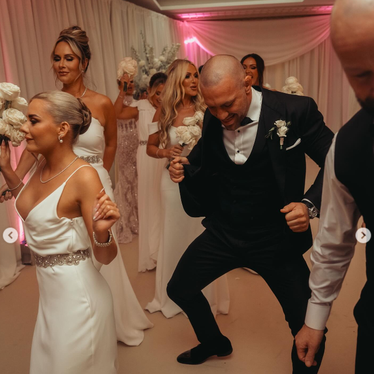 Conor McGregor, Dee Devlin, Taylor Kavanagh, and other guests dance at Terry Kavanagh and Erin McGregors wedding reception on August 17, 2024 | Source: Instagram/thenotoriousmma