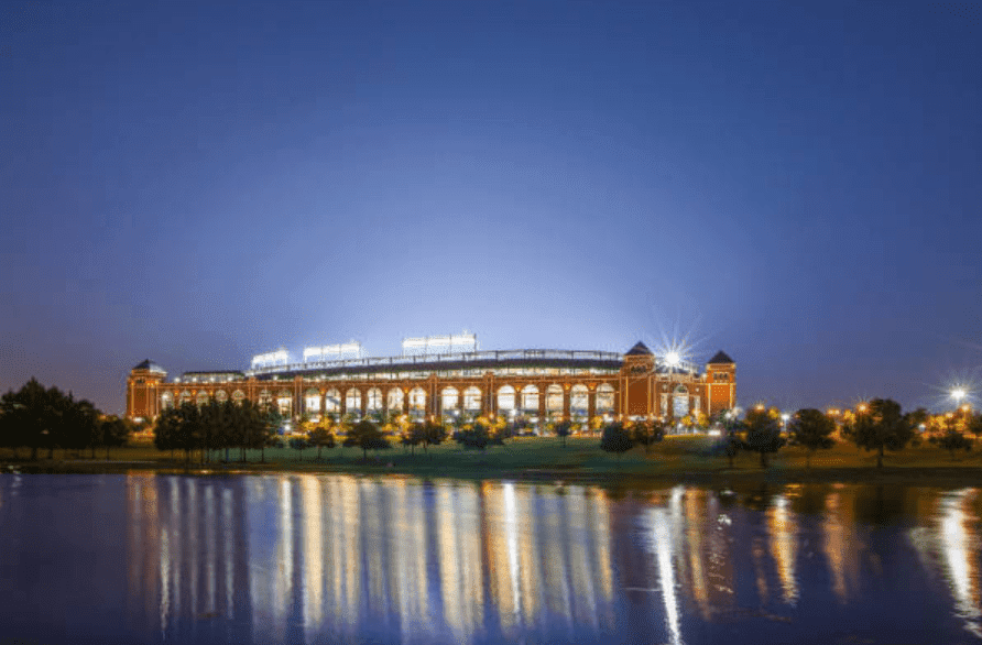 Globe Life Park stadium from a river bed, showing the lights shining bright, at Ballpark in Arlington, Texas | Source: Getty Images