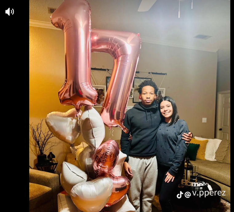Karmelo Anthony and his girlfriend pose together beside large "17" balloons in one of the personal photos included in her TikTok slideshow. | Source: TikTok/v.pperezz