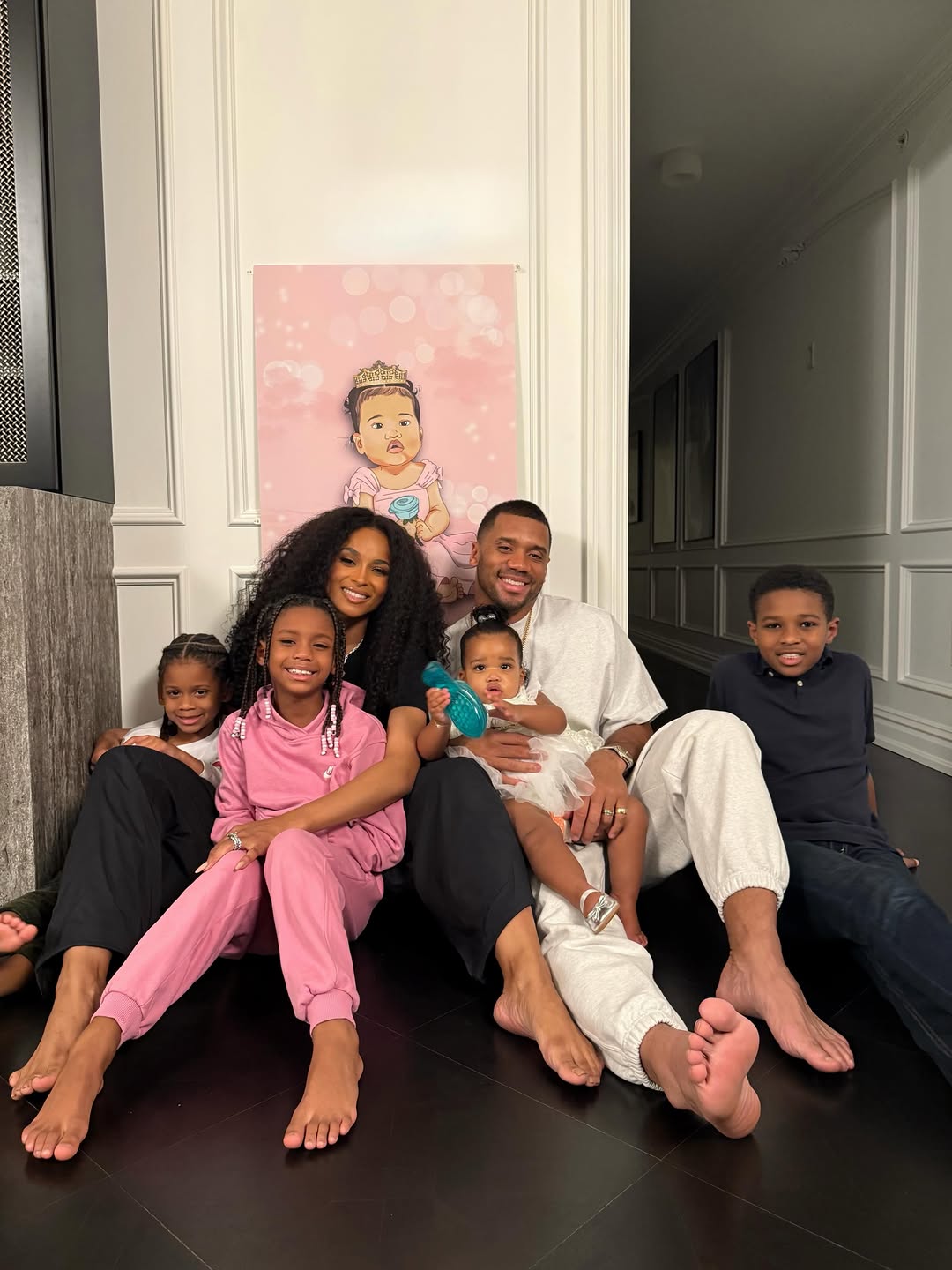 Ciara and Russell Wilson smiling on the floor with their kids. | Source: Instagram/ciara