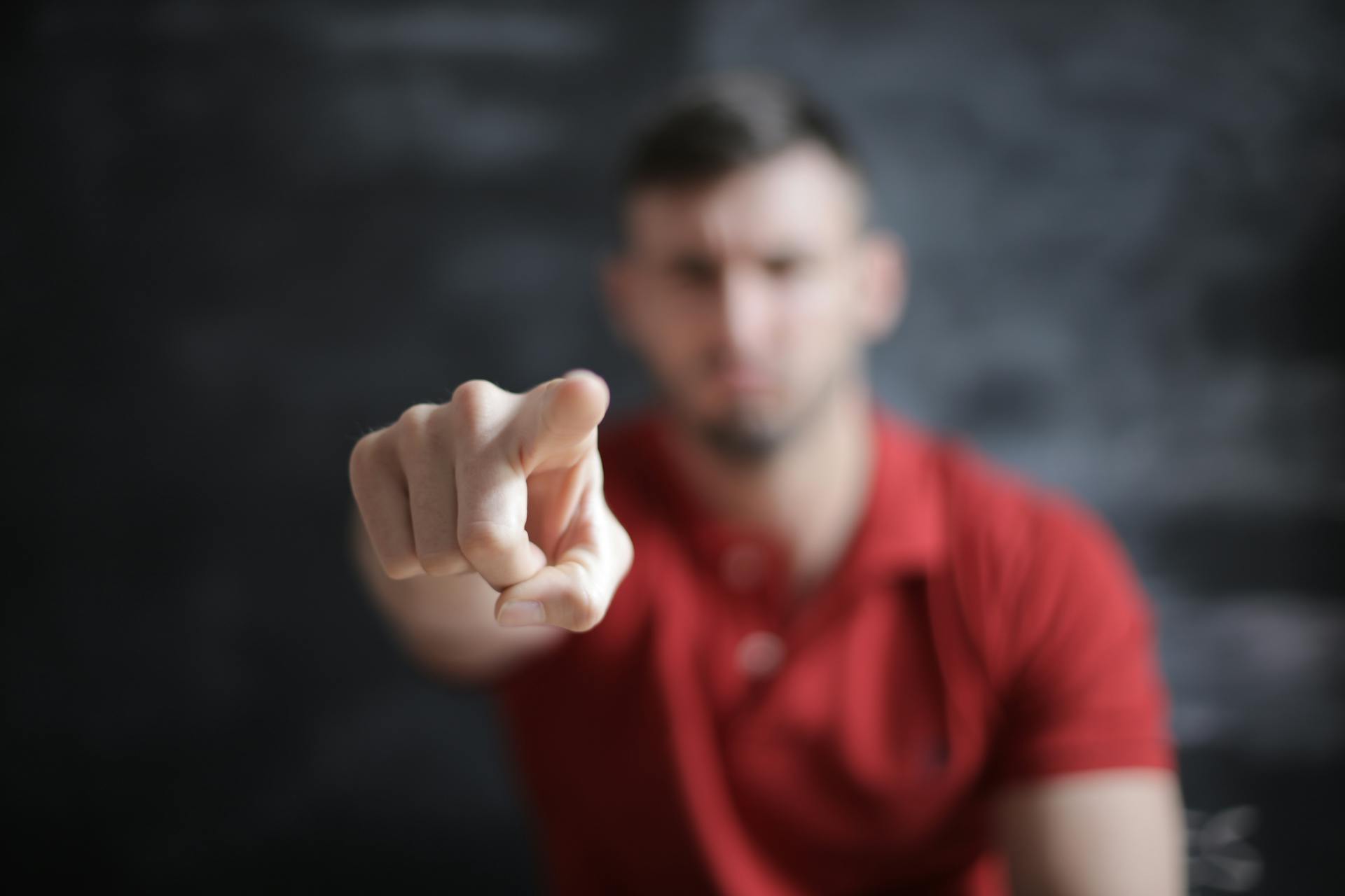 Blurry image of a man pointing a finger | Source: Pexels